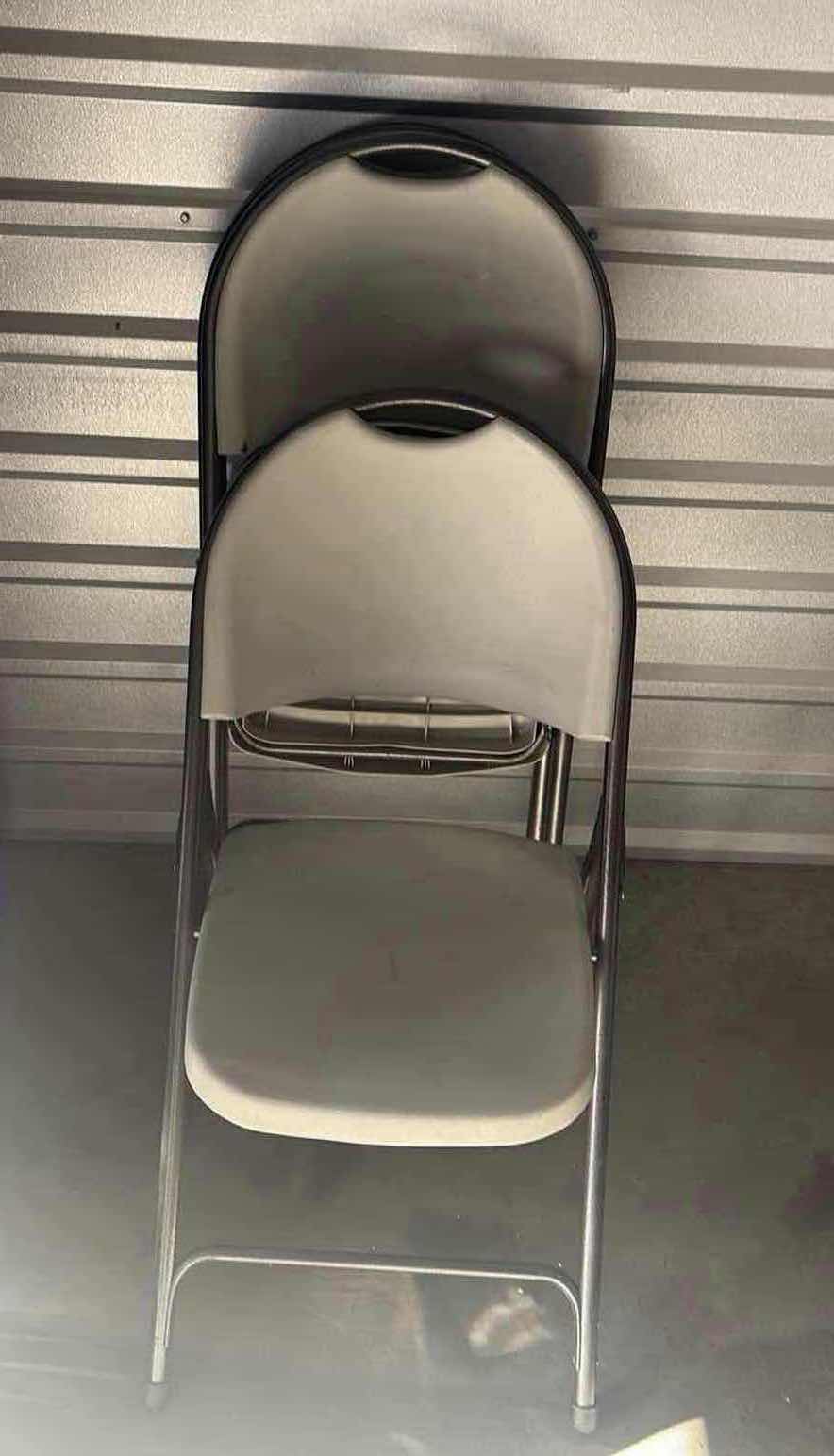 Photo 1 of FOUR PLASTIC FOLDING CHAIRS GRAY