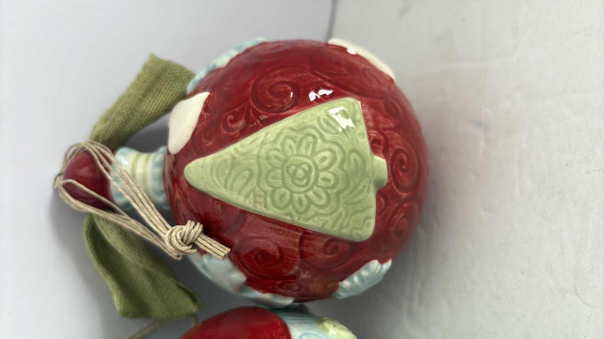 Photo 1 of TWO HANDCRAFTED ROUND CERAMIC ORNAMENTS 6”