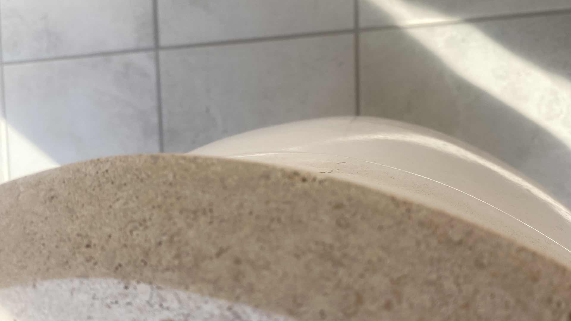 Photo 1 of ROUND OUTDOOR HEAVY END TABLE WITH STONE TOP FROM WYNN LAS VEGAS (2 AVAILABLE EACH SOLD SEPARATELY) 14 1/2” x 23”