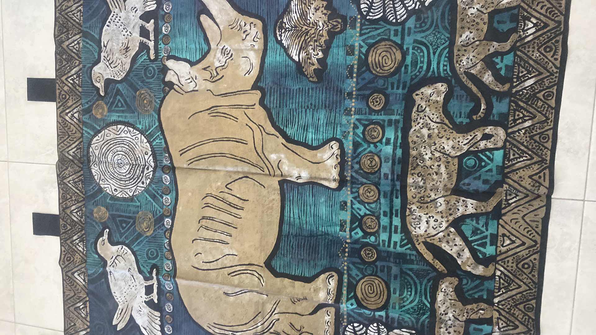 Photo 1 of VINTAGE MIXED MEDIA ORIGINAL PAINTED RHINO & LIONESSES ON FABRIC SIGNED, PURCHASED IN SOUTH AFRICA 5’ X 5’ EXCLUDING STRAPS