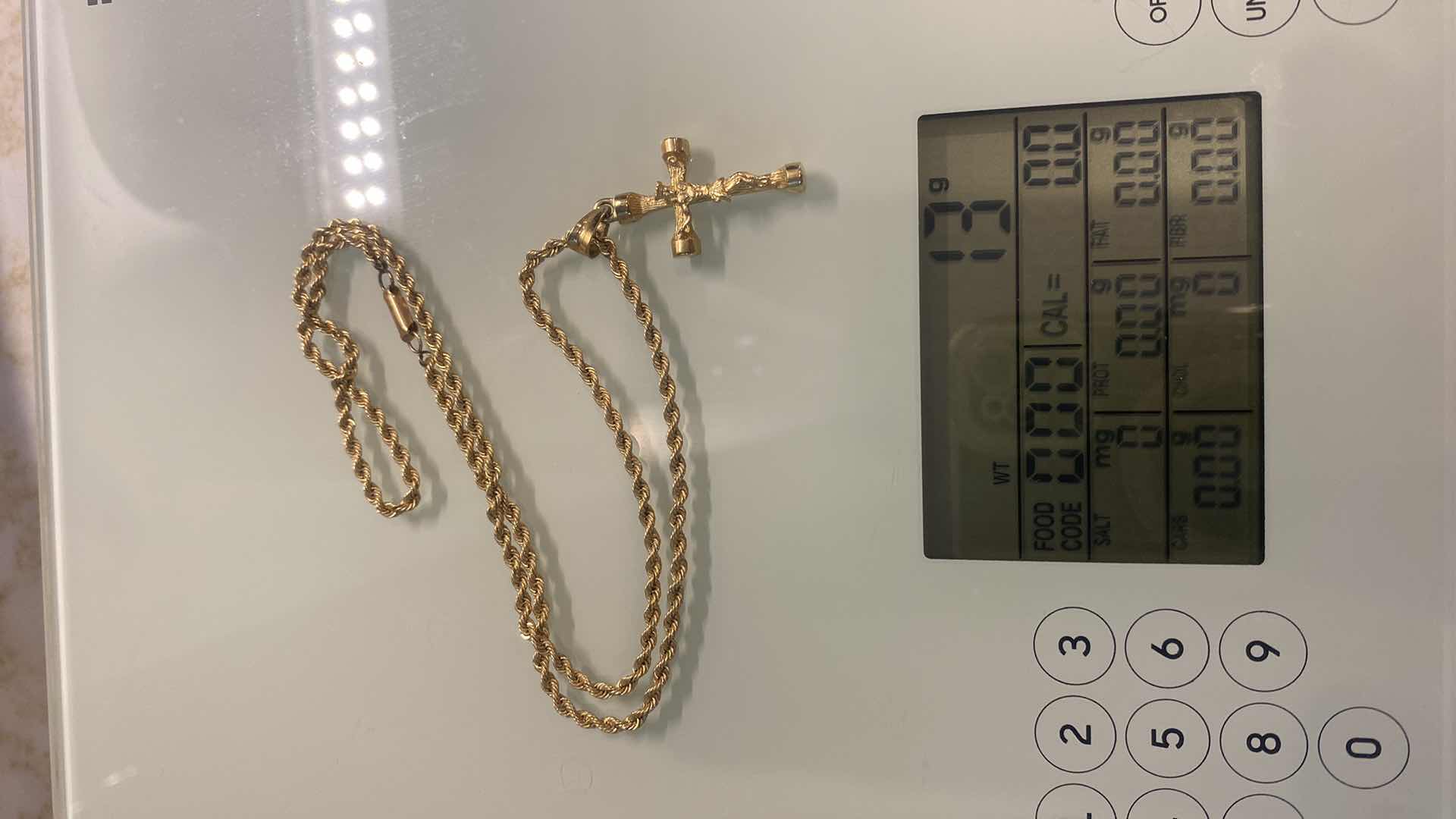 Photo 1 of WOMEN’S10K GOLD STAMPED CHAIN WITH CRUCIFIX PENDANT STAMPED 10K,  1 1/2 INCHES DROP JEWELRY