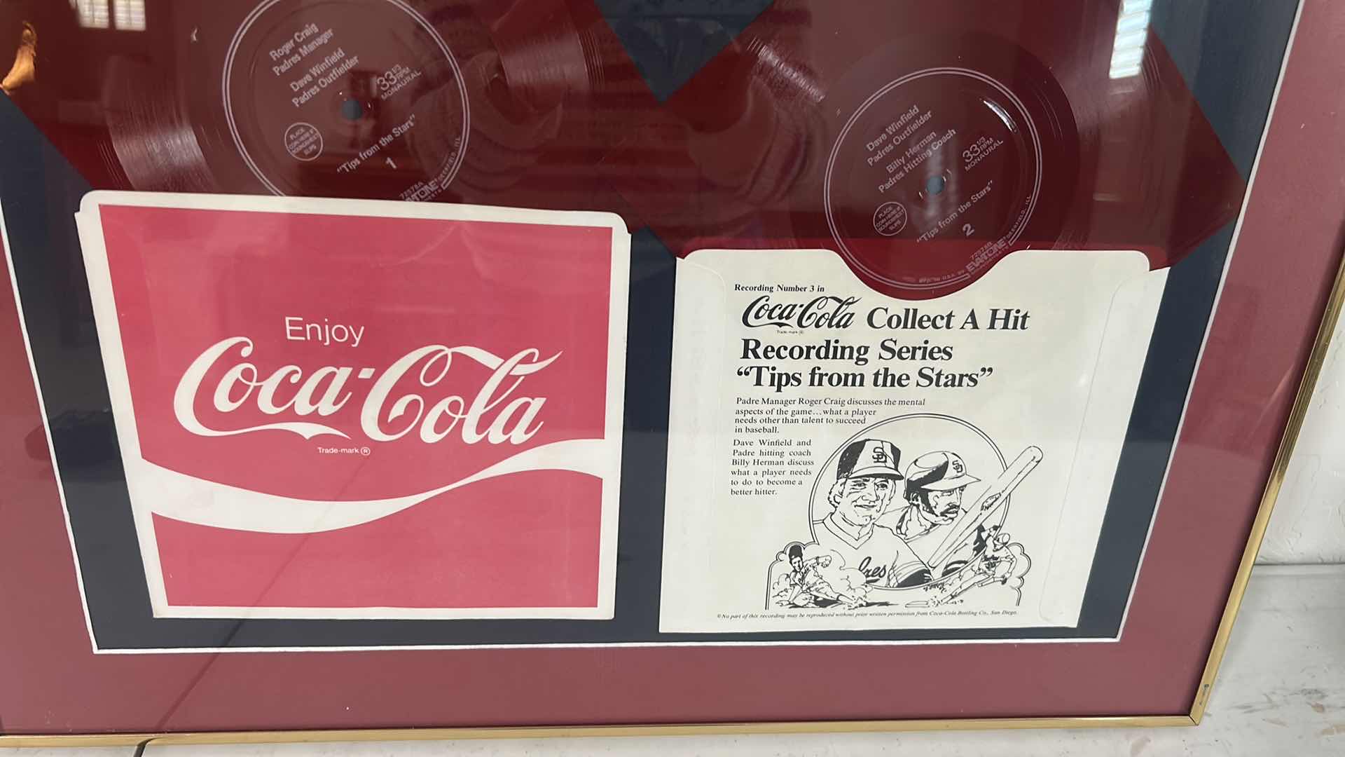 View 2 of GOLD FRAMED COLLECTIBLE W VINTAGE COCA COLA RED FLEXI DISC RECORD SET SLEEVE FROM 1970 SAN DIEGO PADRE 23" X 20"