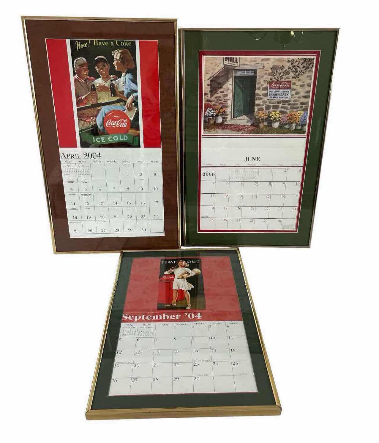 View 1 of THREE VINTAGE FRAMED COCA COLA ADVERTISING CALENDAR PAGES FROM 2000