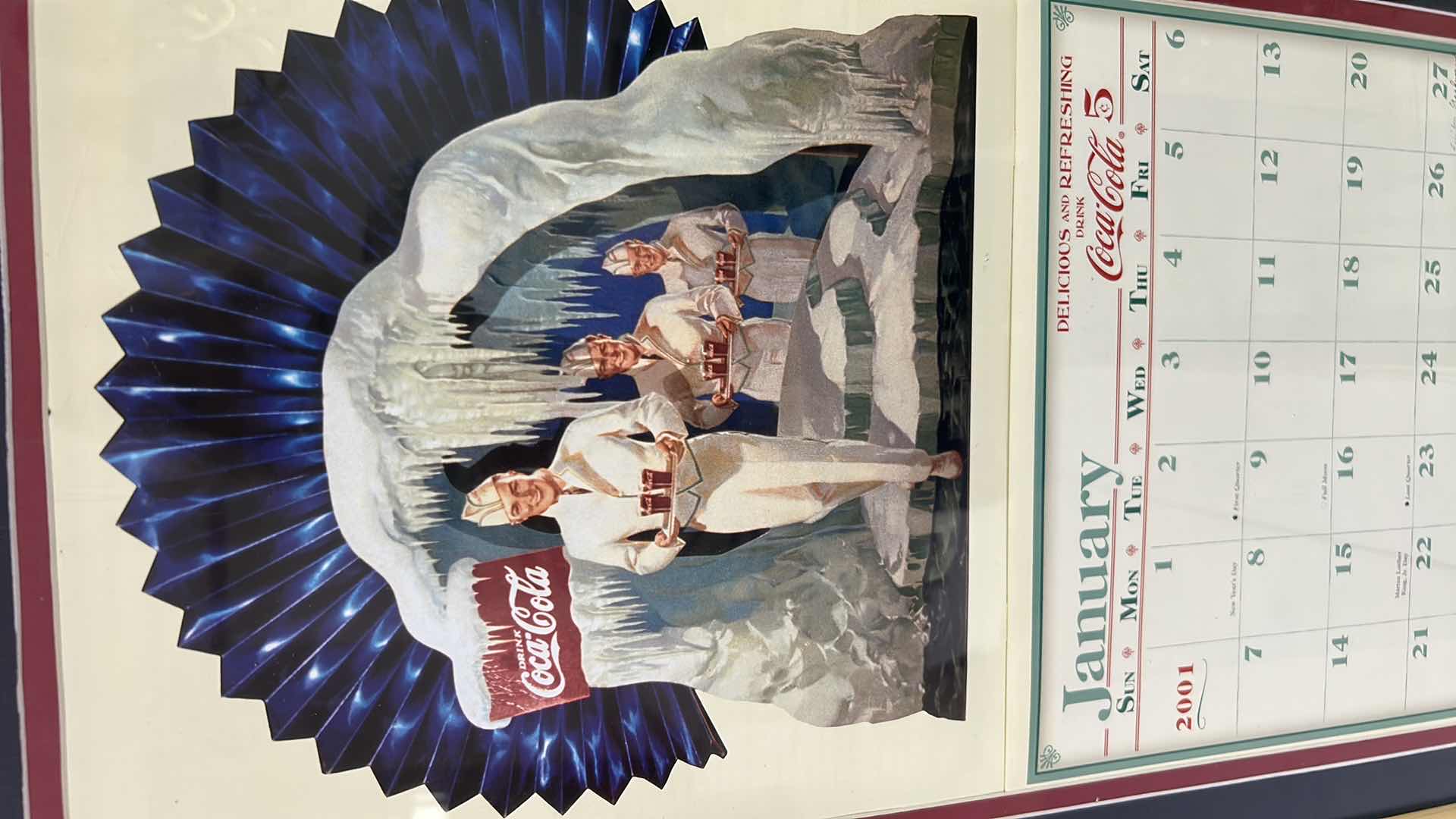 View 2 of THREE VINTAGE FRAMED COCA COLA ADVERTISING CALENDAR PAGES FROM 1973/ 2005
14" X 22" 15" X 26"