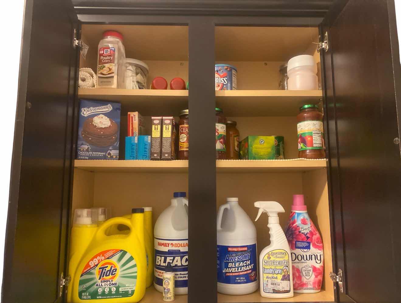 View 1 of CONTENTS OF CABINET-LAUNDRY SUPPLIES AND KITCHEN STAPLES ONE TIDE IS FULL