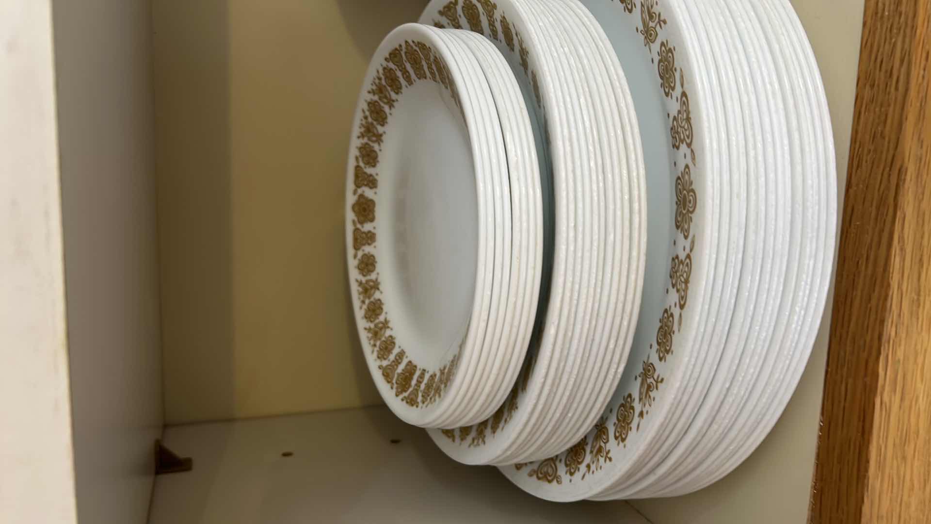 Photo 1 of CORELL DISHES. CONTENTS OF KITCHEN CABINET.