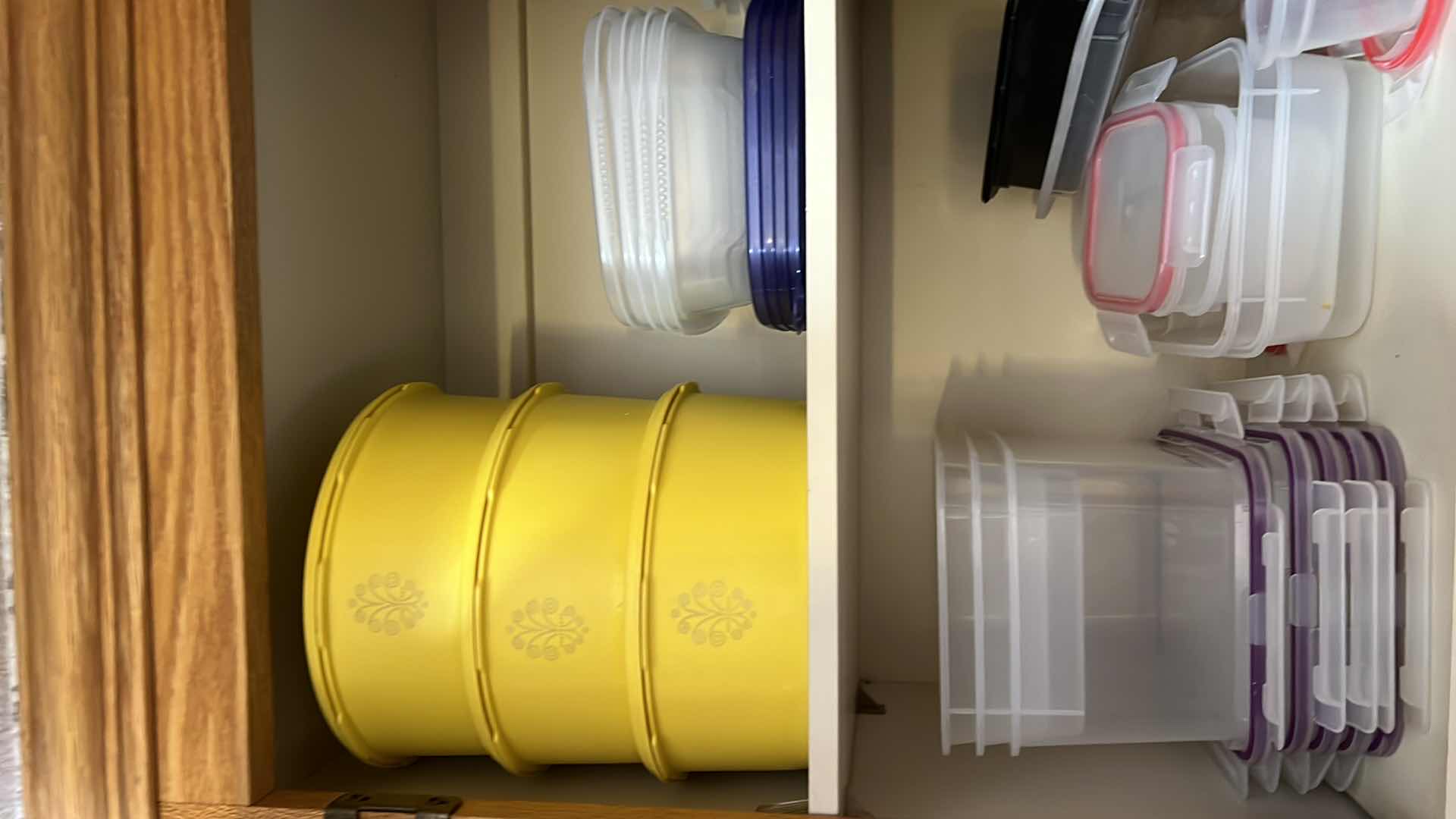 Photo 1 of CONTENTS OF KITCHEN CABINET. FOOD STORAGE AND BOWLS.