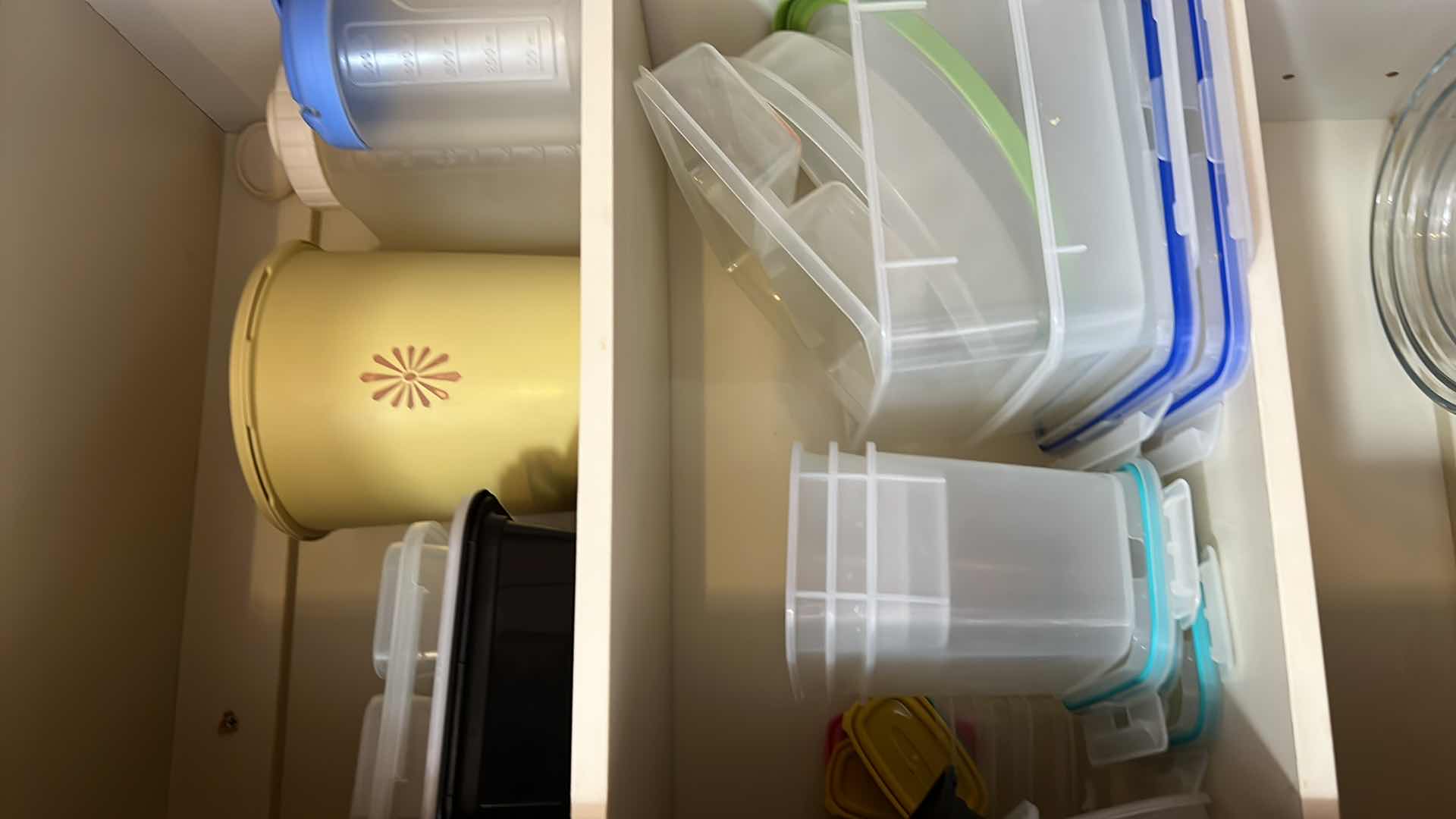 Photo 1 of CONTENTS OF KITCHEN CABINET. CONTAINERS FOR FOOD.