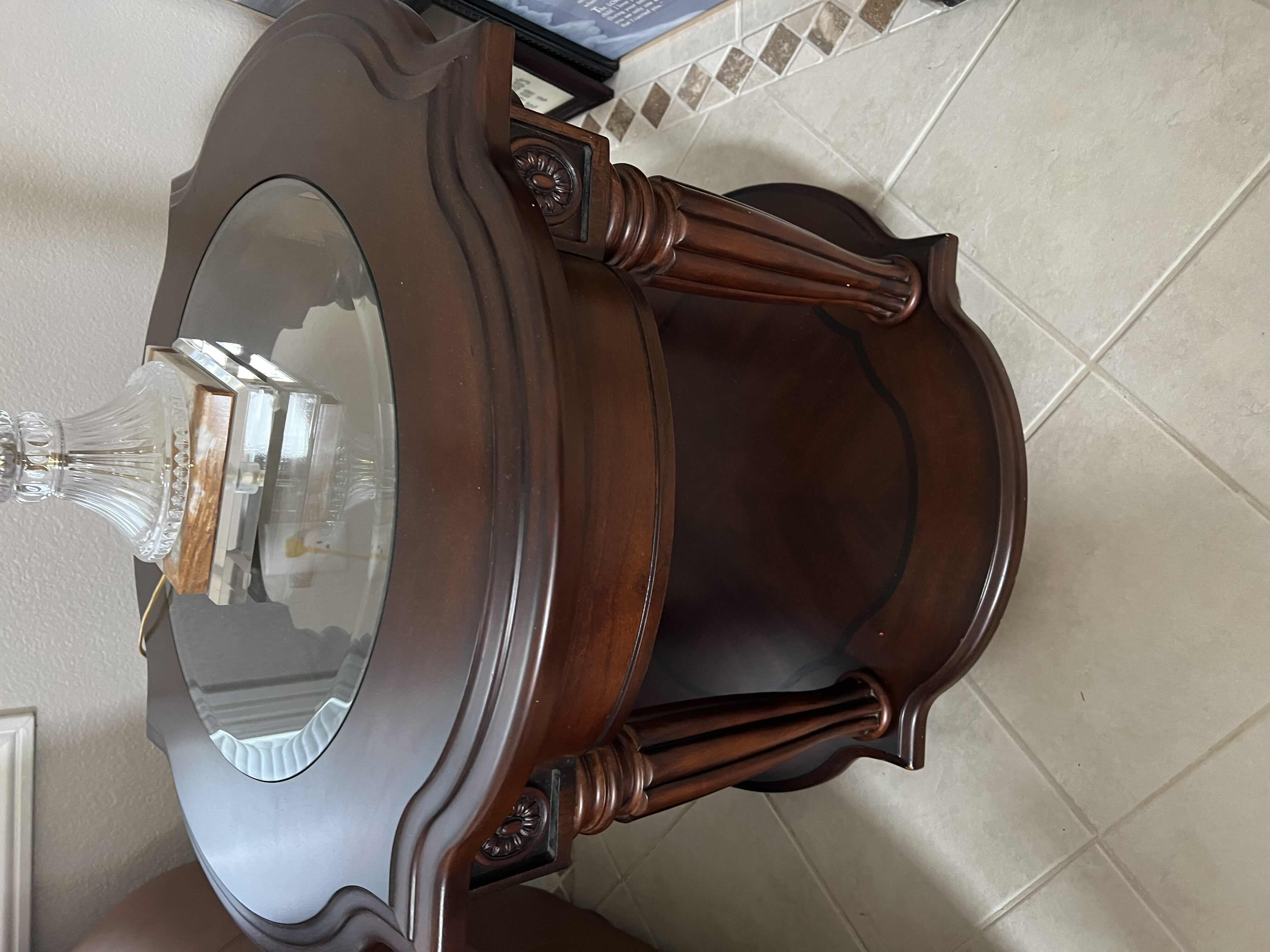 Photo 1 of MAHONGANY COLOR WOODEN AND GLASS END TABLE. 24”H PART OF SET OF 2 (SOLD SEPARATELY) TABLE ONLY. MATCHING COFFEE TABLE ALSO AVAILABLE FOR PURCHASE.