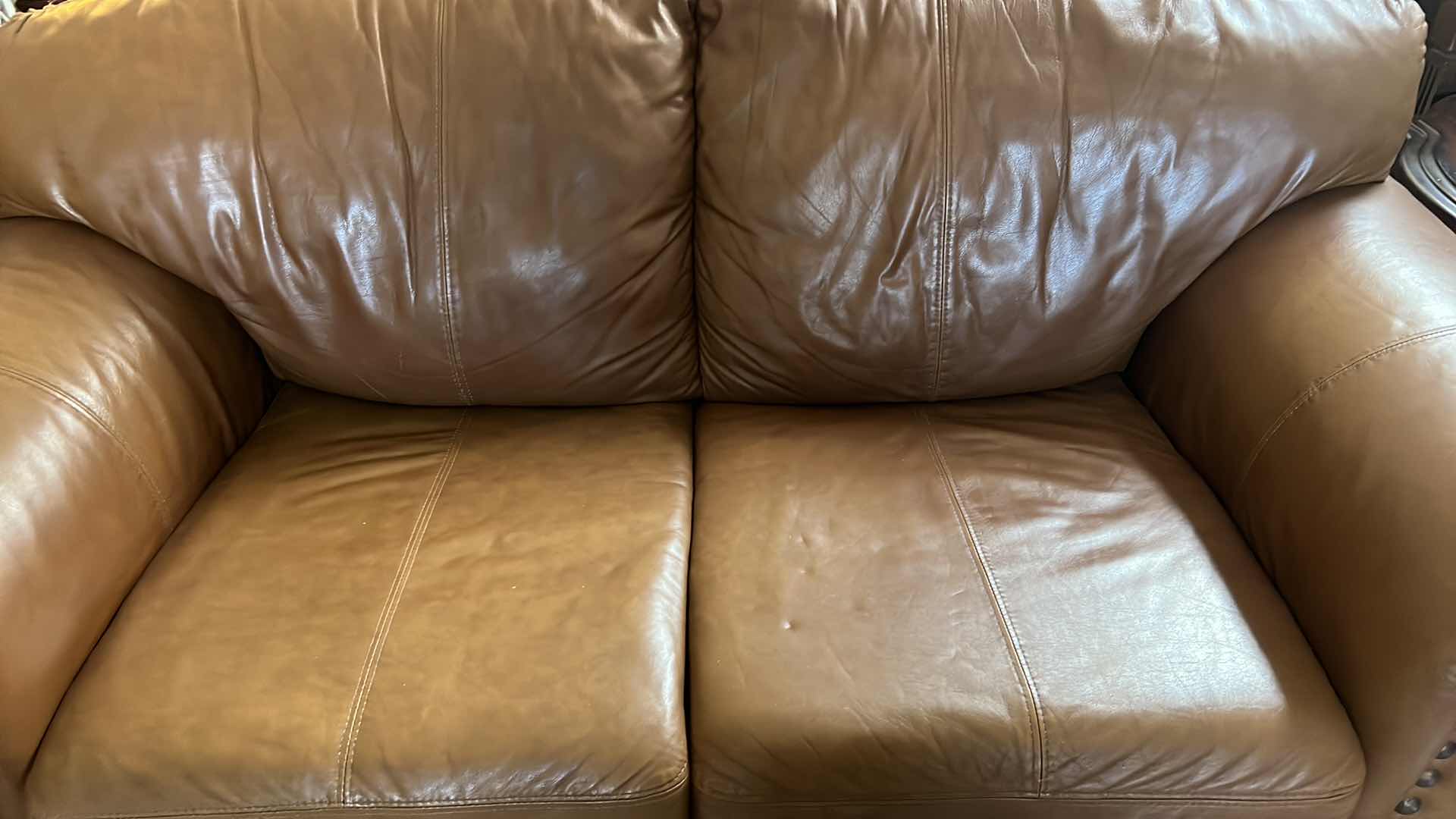 Photo 1 of 71”OVER STUFFED GENUINE LEATHER LOVE SEAT. PART OF MATCHING LIVING ROOM SET OF 3 PIECES (COUCH AND CHAIR SOLD SEPARATLEY)
