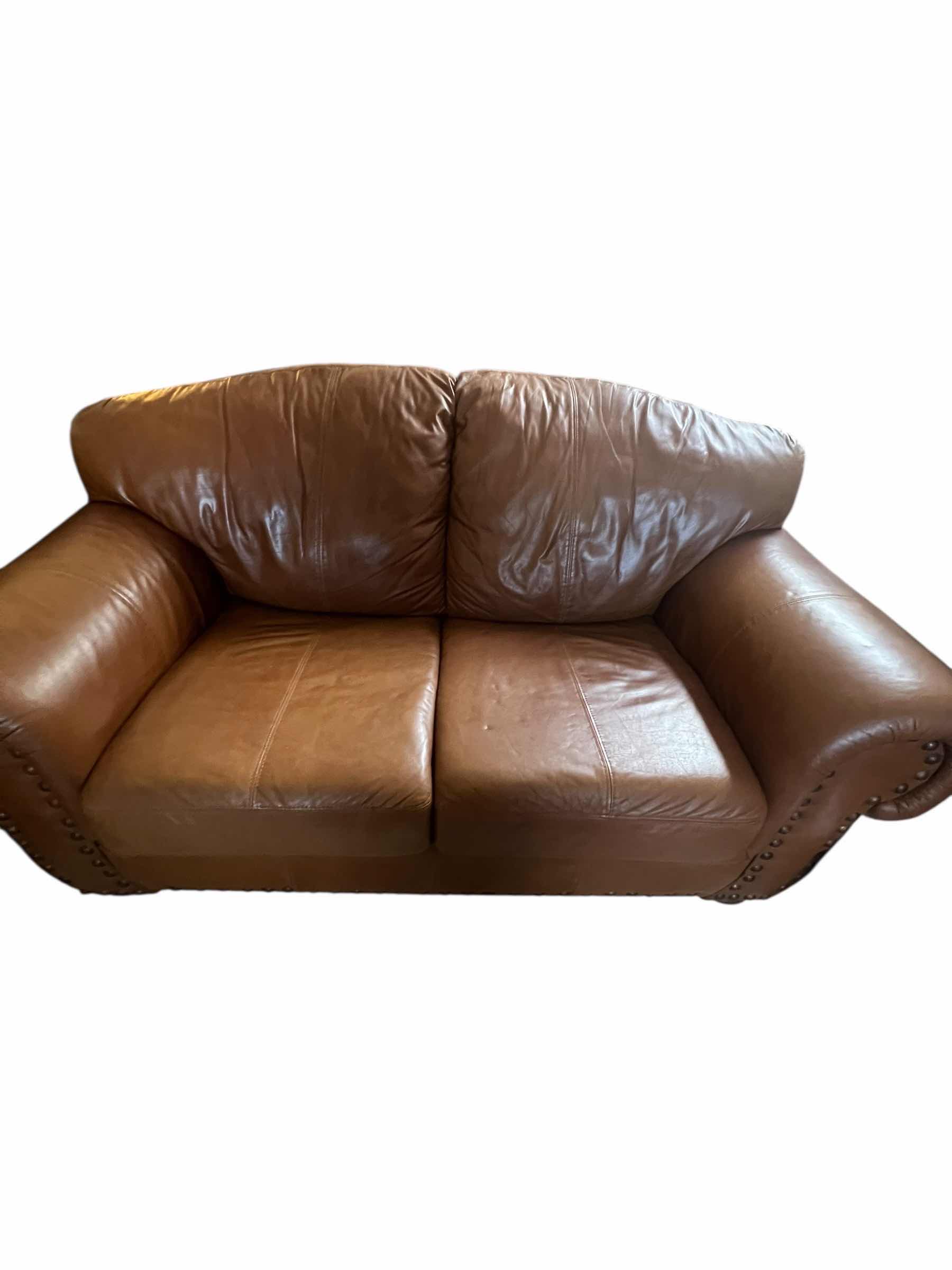 Photo 1 of 71”OVER STUFFED GENUINE LEATHER LOVE SEAT. PART OF MATCHING LIVING ROOM SET OF 3 PIECES (COUCH AND CHAIR SOLD SEPARATLEY)