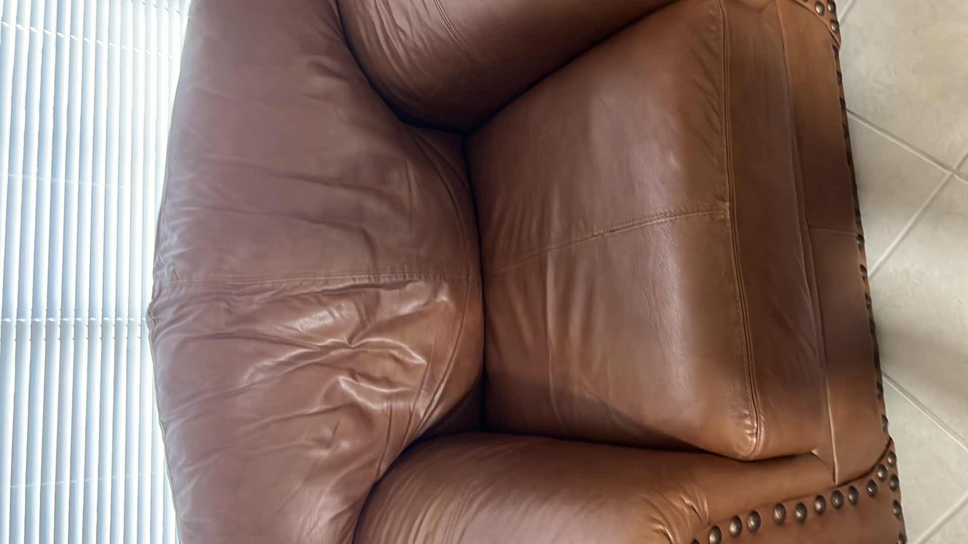 Photo 1 of OVER STUFFED GENUINE LEATHER CHAIR. PART OF MATCHING LIVING ROOM SET OF 3 PIECES (COUCH AND LOVE SEAT SOLD SEPARATLEY)