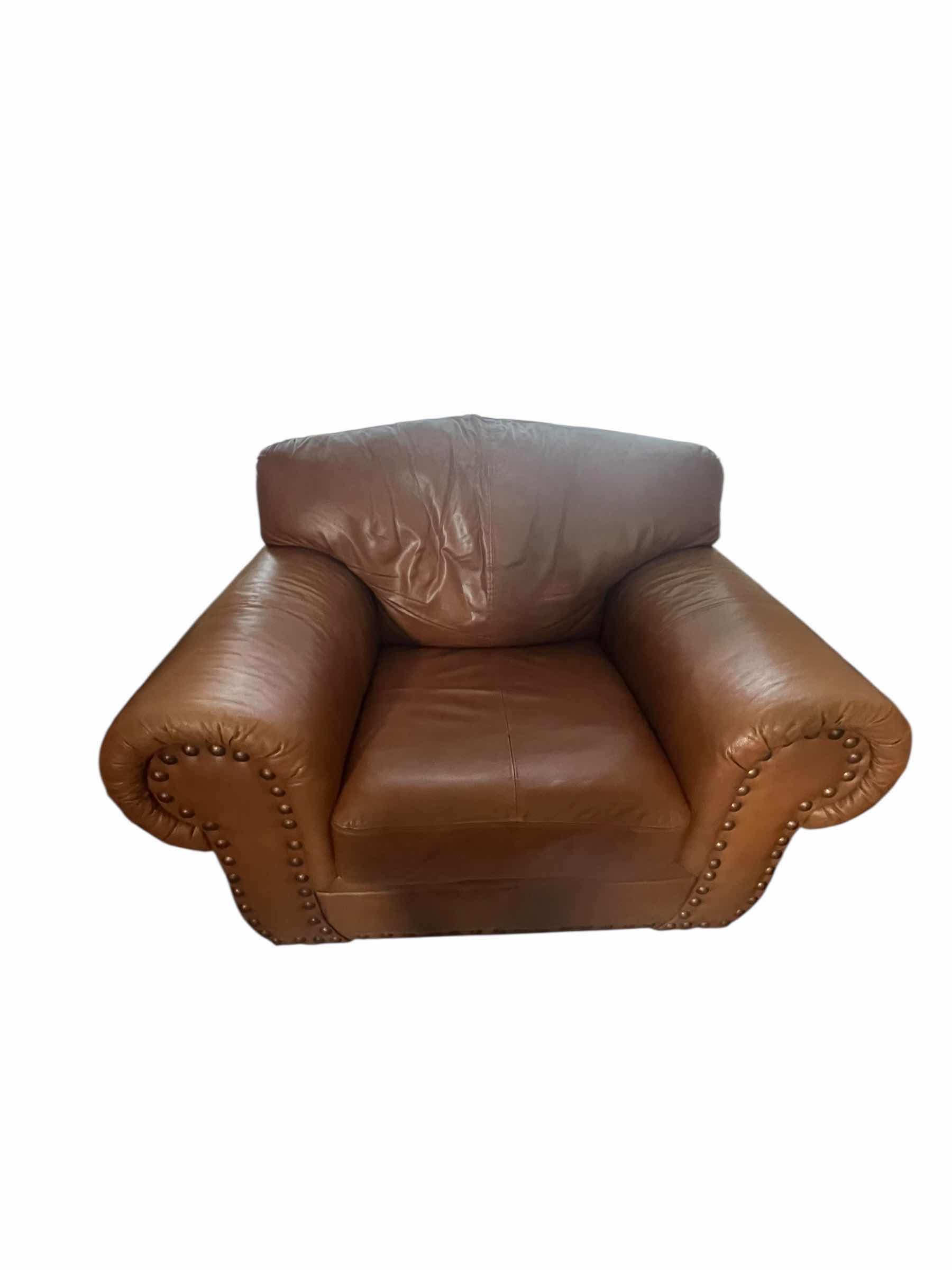 Photo 1 of OVER STUFFED GENUINE LEATHER CHAIR. PART OF MATCHING LIVING ROOM SET OF 3 PIECES (COUCH AND LOVE SEAT SOLD SEPARATLEY)