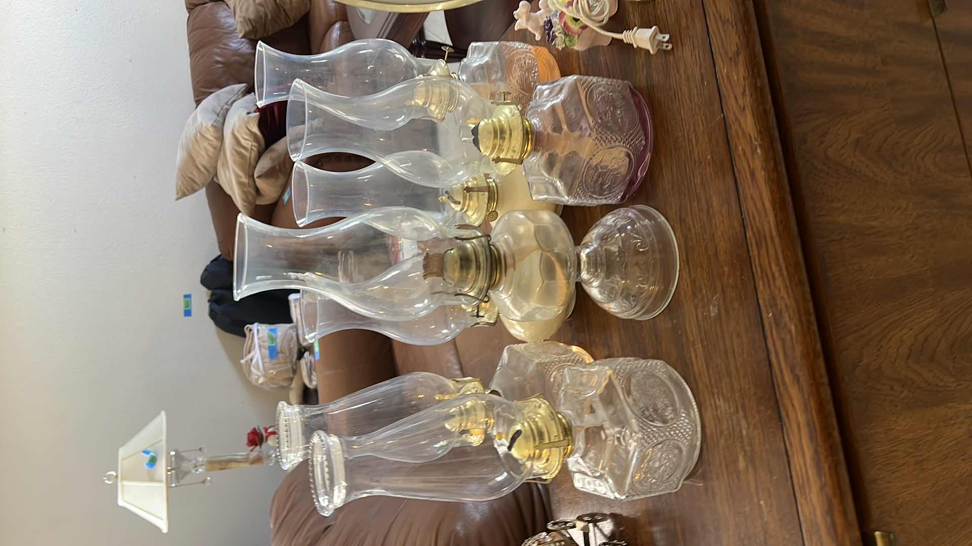 Photo 1 of VINTAGE DECORATIVE AND FUNCTIONAL OIL LANTERNS. 12”H GLASS