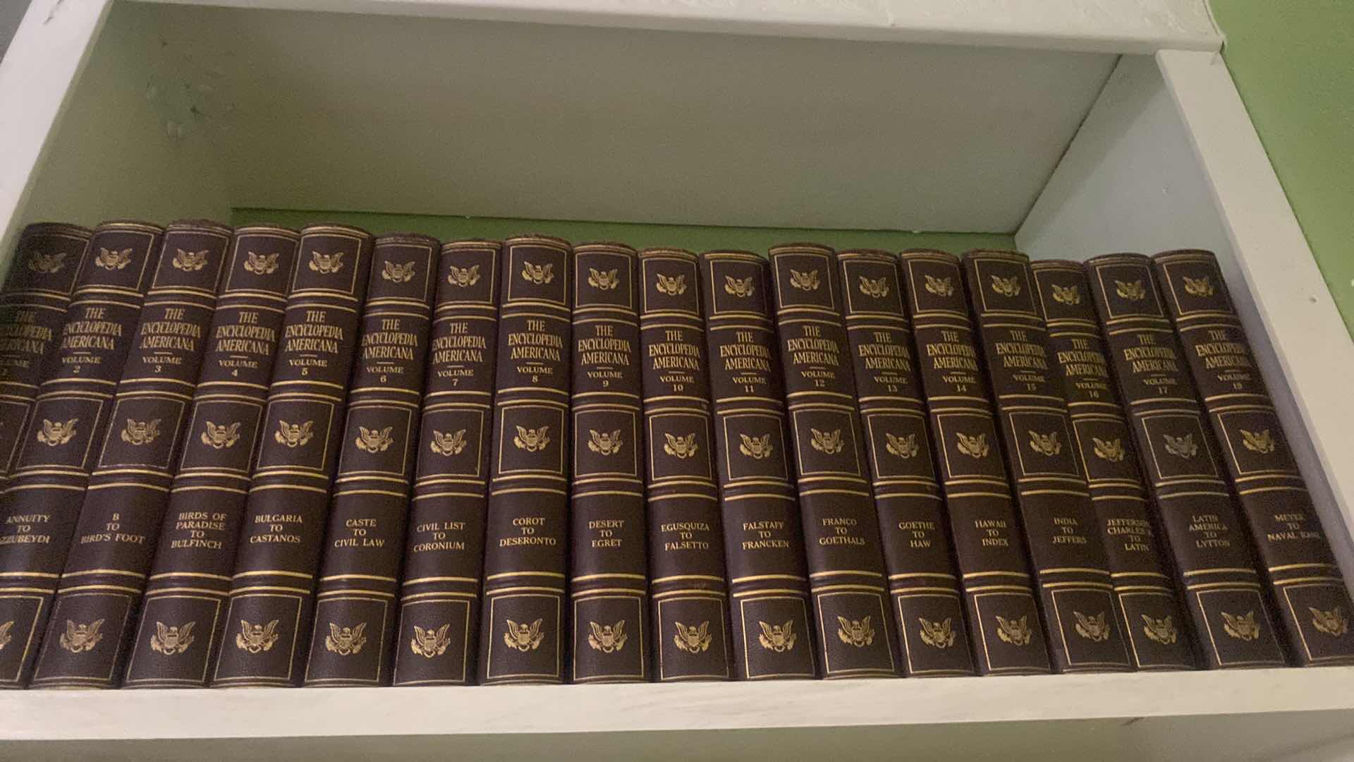 Photo 1 of 2 SHELF OF BOOKS - AMERICANA ENCYCLOPEDIAS