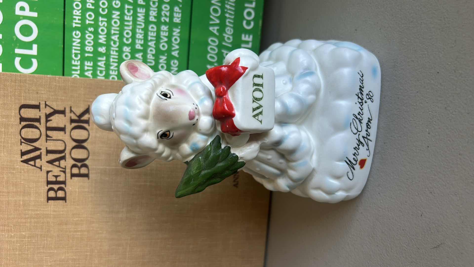 Photo 1 of 1 VINTAGE CHERISHED MOMENTS AVON FIGURINE & 2 AVON BOOKS