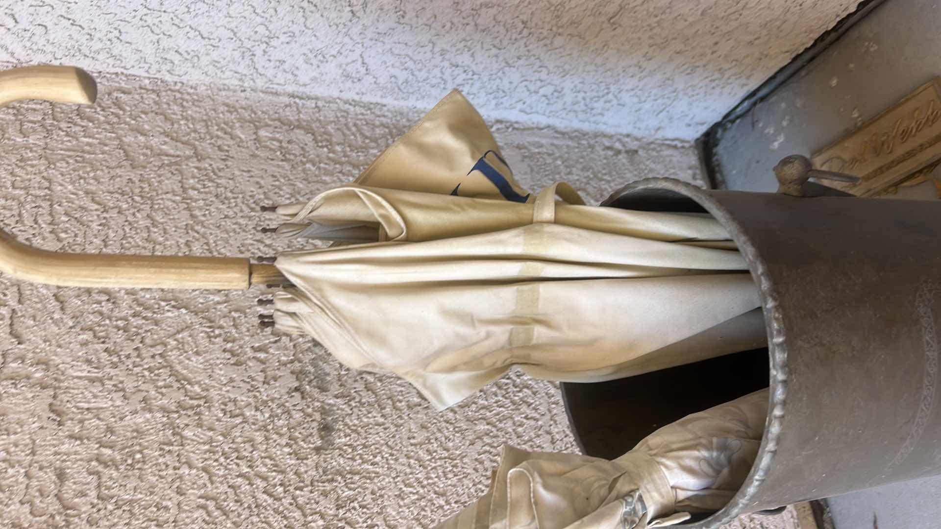 Photo 1 of METAL UMBRELLA STAND WITH VINTAGE AVON UMBRELLAS