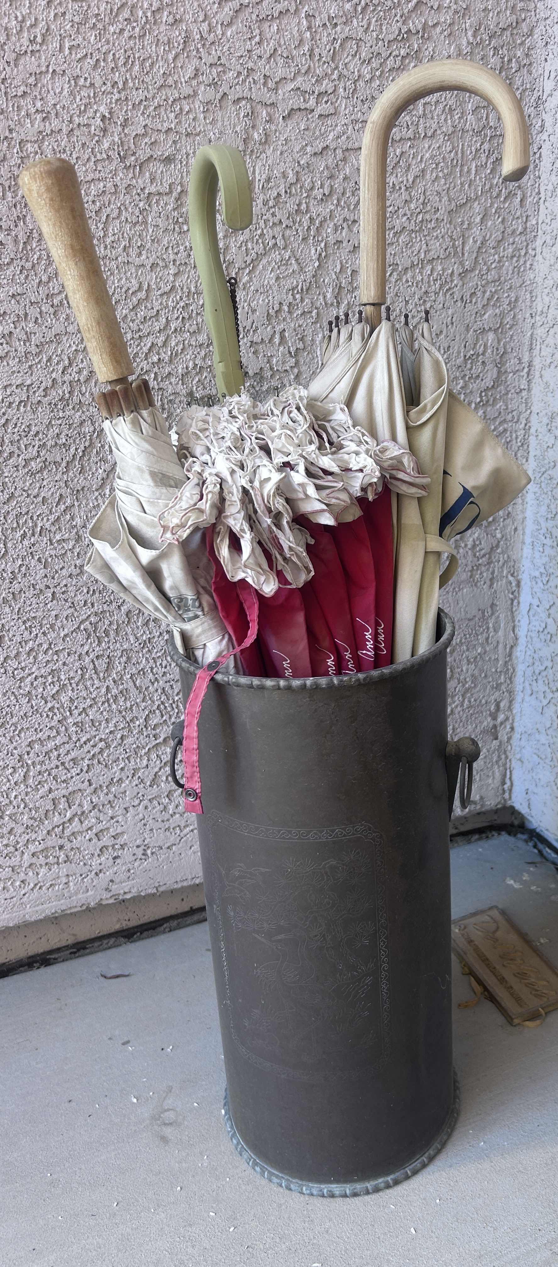 Photo 1 of METAL UMBRELLA STAND WITH VINTAGE AVON UMBRELLAS