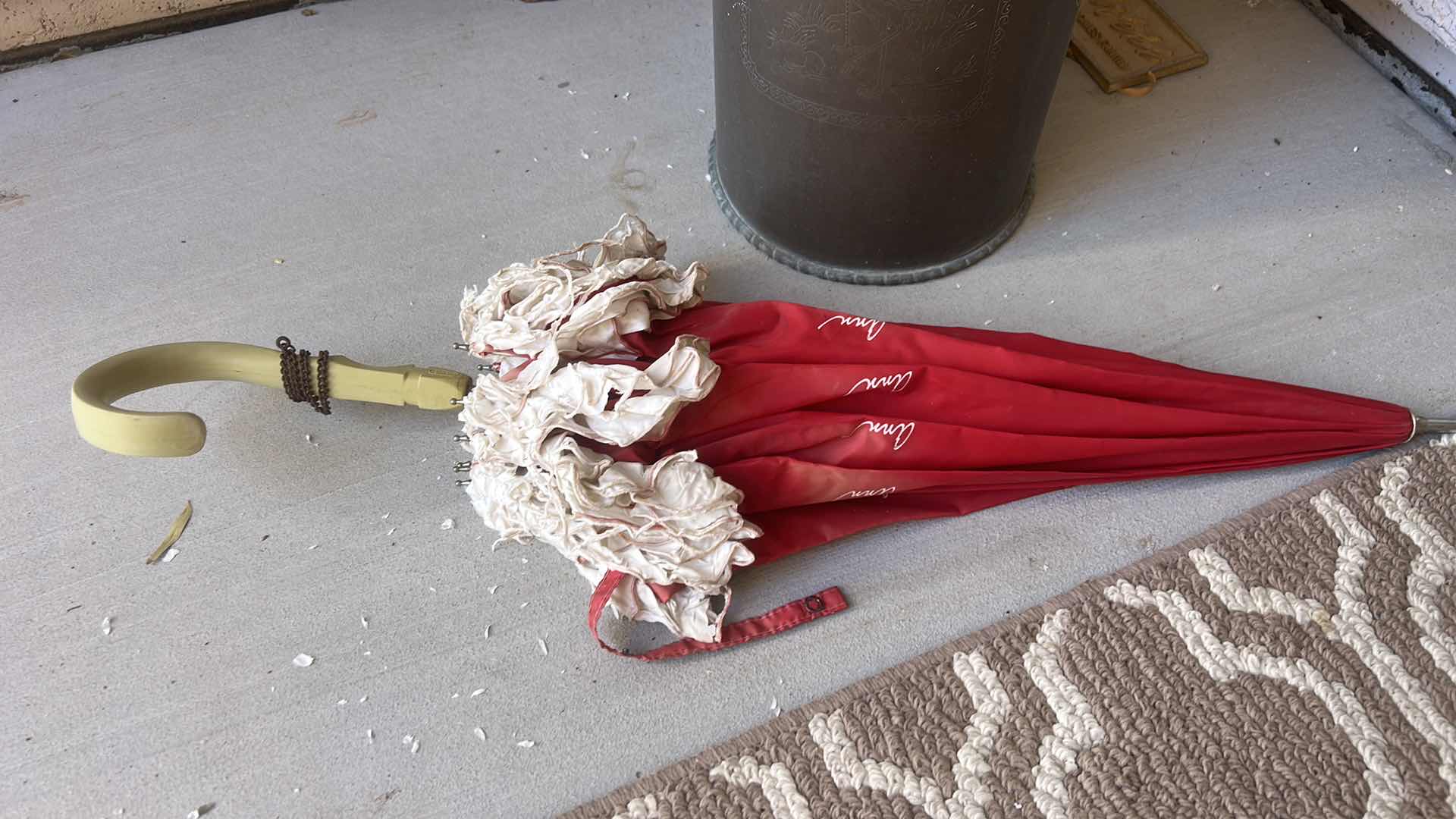 Photo 1 of METAL UMBRELLA STAND WITH VINTAGE AVON UMBRELLAS