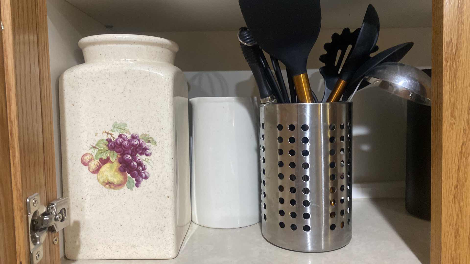 Photo 1 of CONTENTS OF CABINET - CANISTERS & COOKING TOOLS