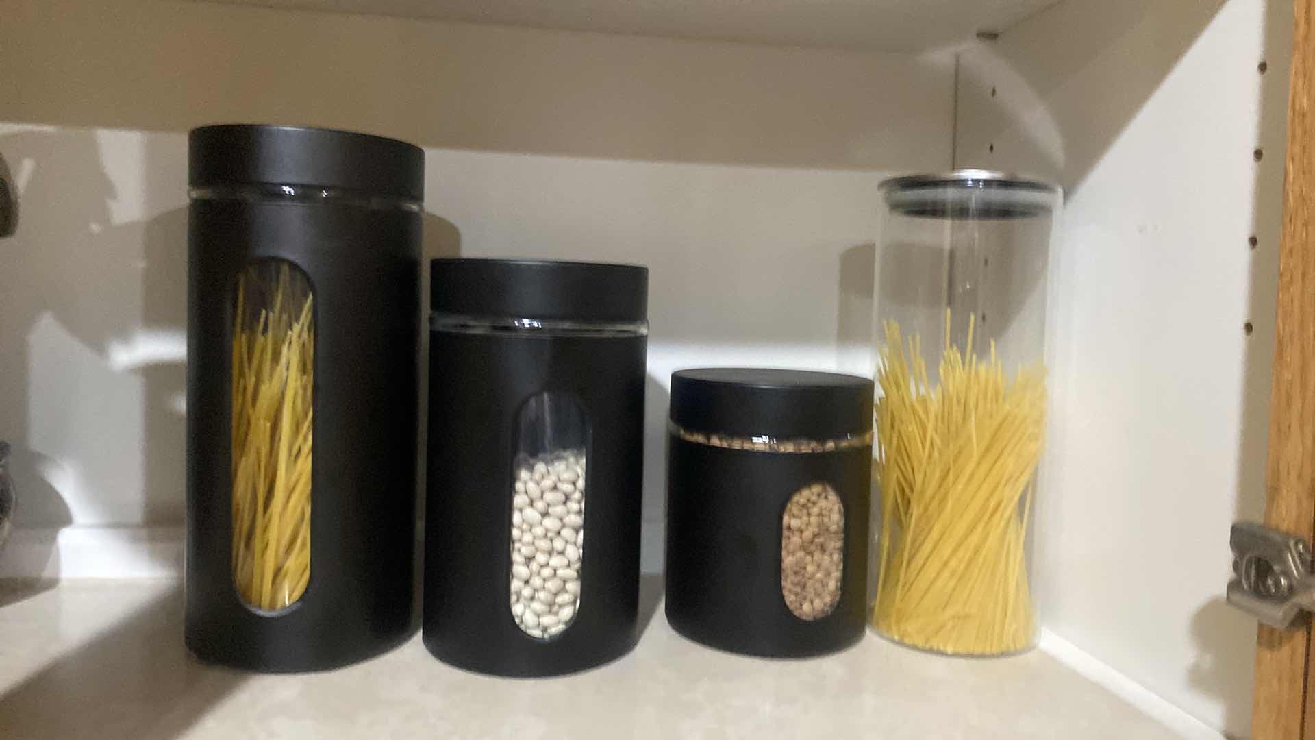 Photo 1 of CONTENTS OF CABINET - CANISTERS & COOKING TOOLS