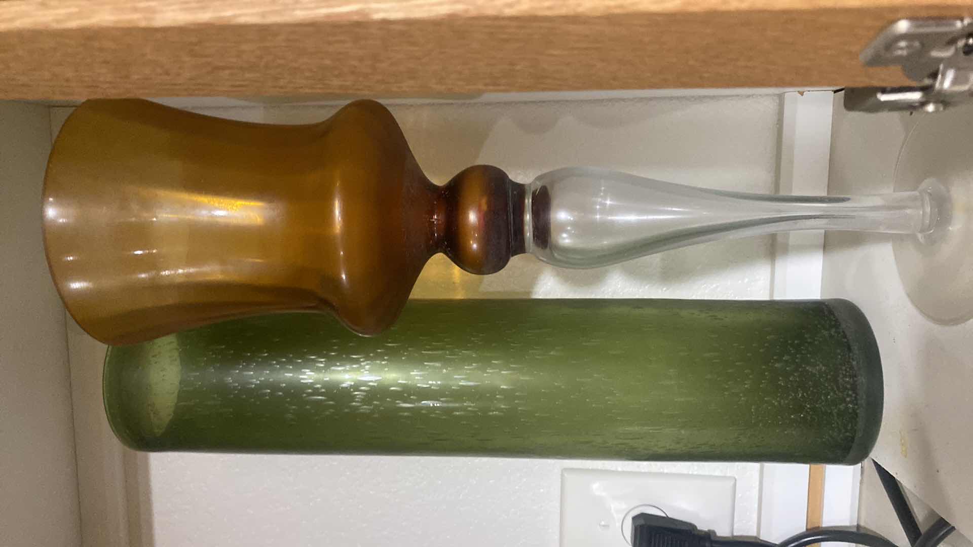 Photo 1 of CONTENTS OF CABINET - GLASS CANDLE HOLDER & GREEN GLASS VASE H17”