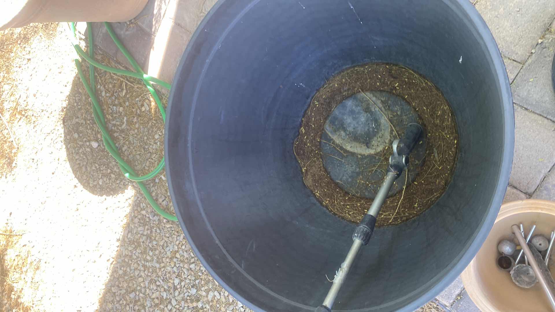 Photo 1 of CERAMICS C POT, PLASTIC BARREL POT AND WATERING CAN LARGEST 25” x 15”