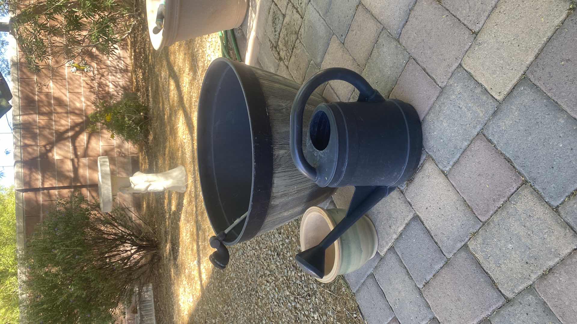 Photo 1 of CERAMICS C POT, PLASTIC BARREL POT AND WATERING CAN LARGEST 25” x 15”