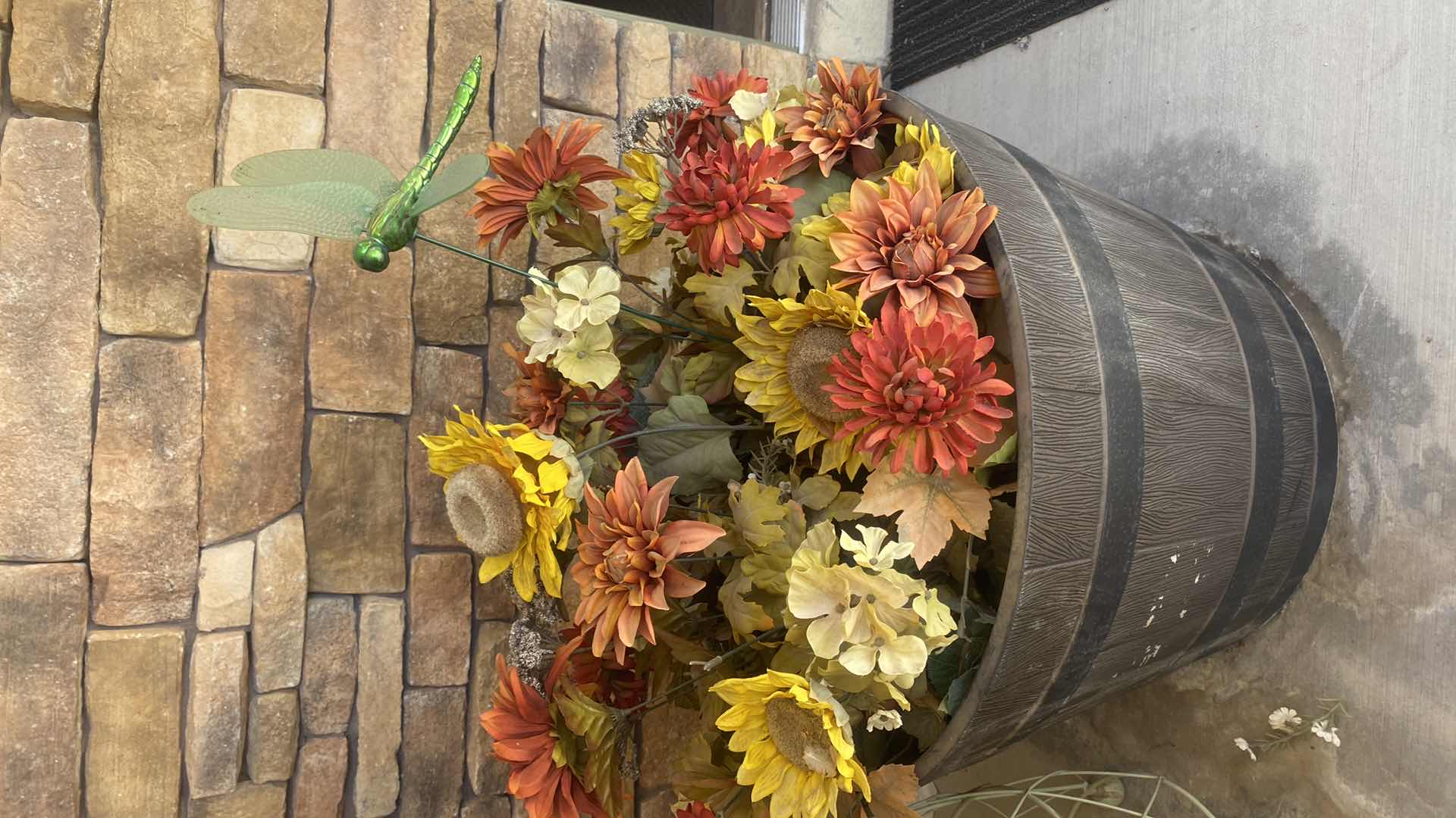 Photo 1 of PLASTIC BARREL POT WITH FAUX FLOWERS & GREEN METAL DECOR H44”