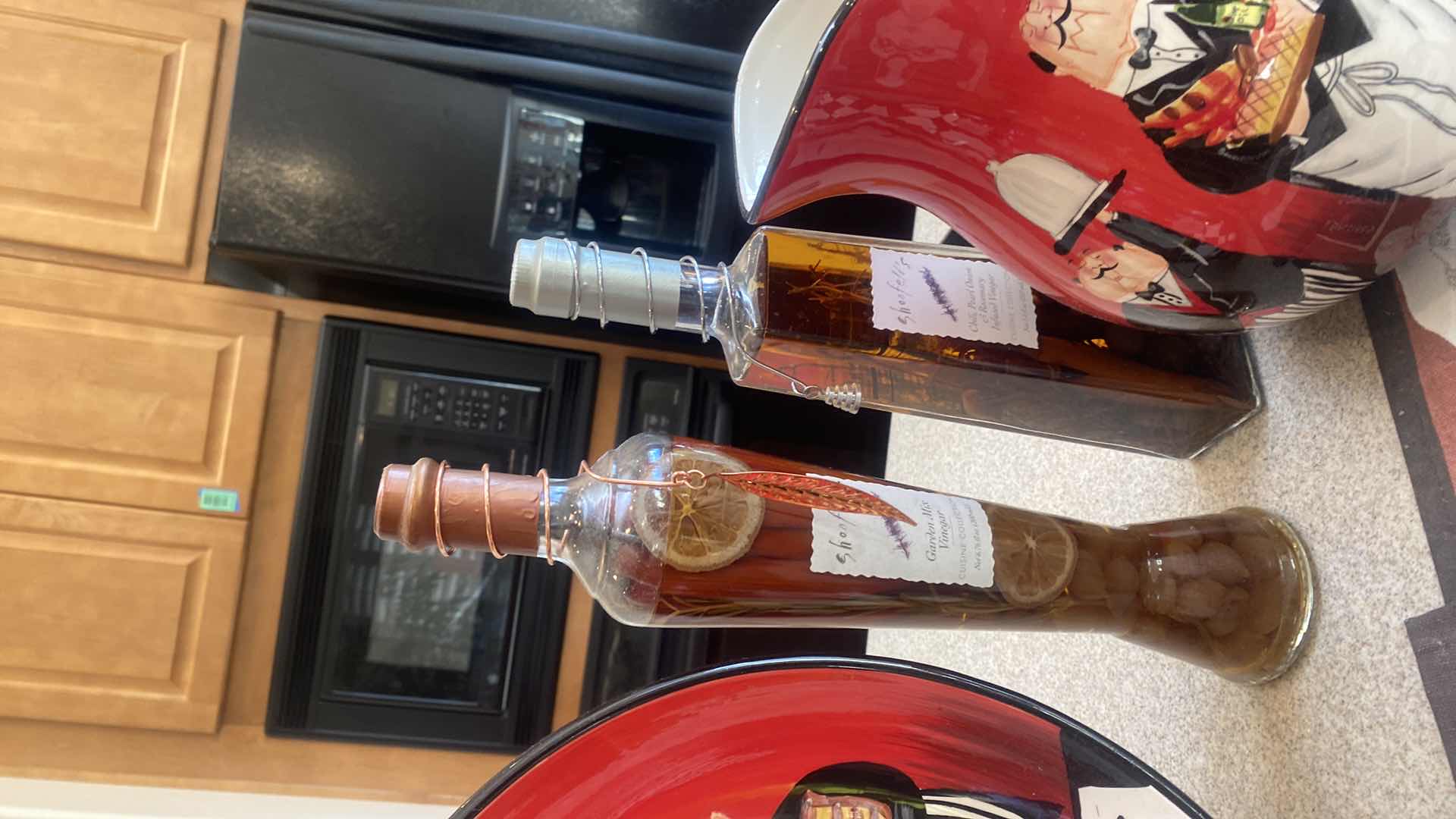 Photo 1 of CERTIFIED INTERNATIONAL “DINNER IS SERVED" BOWL & PITCHER WITH 2 PLACEMATS & 5 BOTTLES VINEGAR HERBS