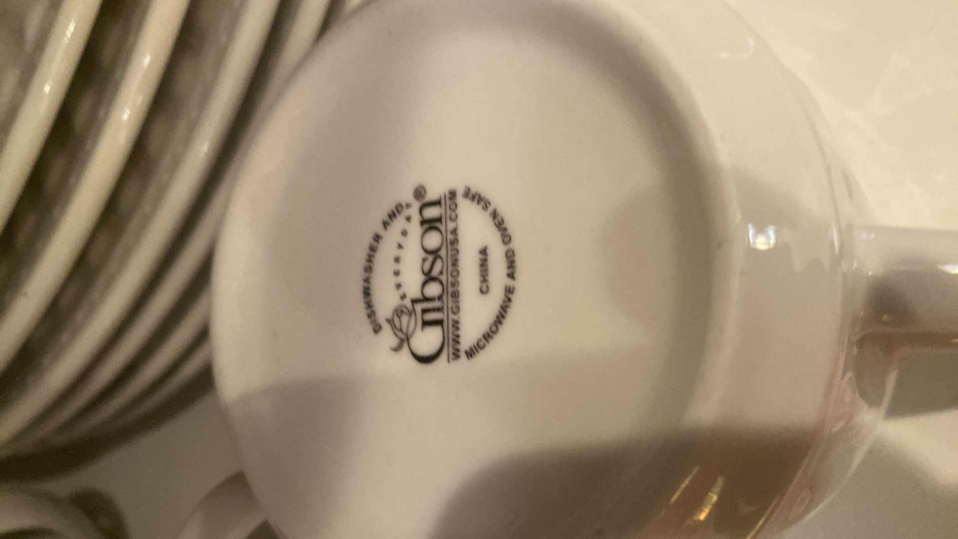 Photo 1 of CONTENTS OF CABINET - 1 SHELF 25 PIECE GIBSON WHITE CHINA & 11 PIECES LYNNS CHINA