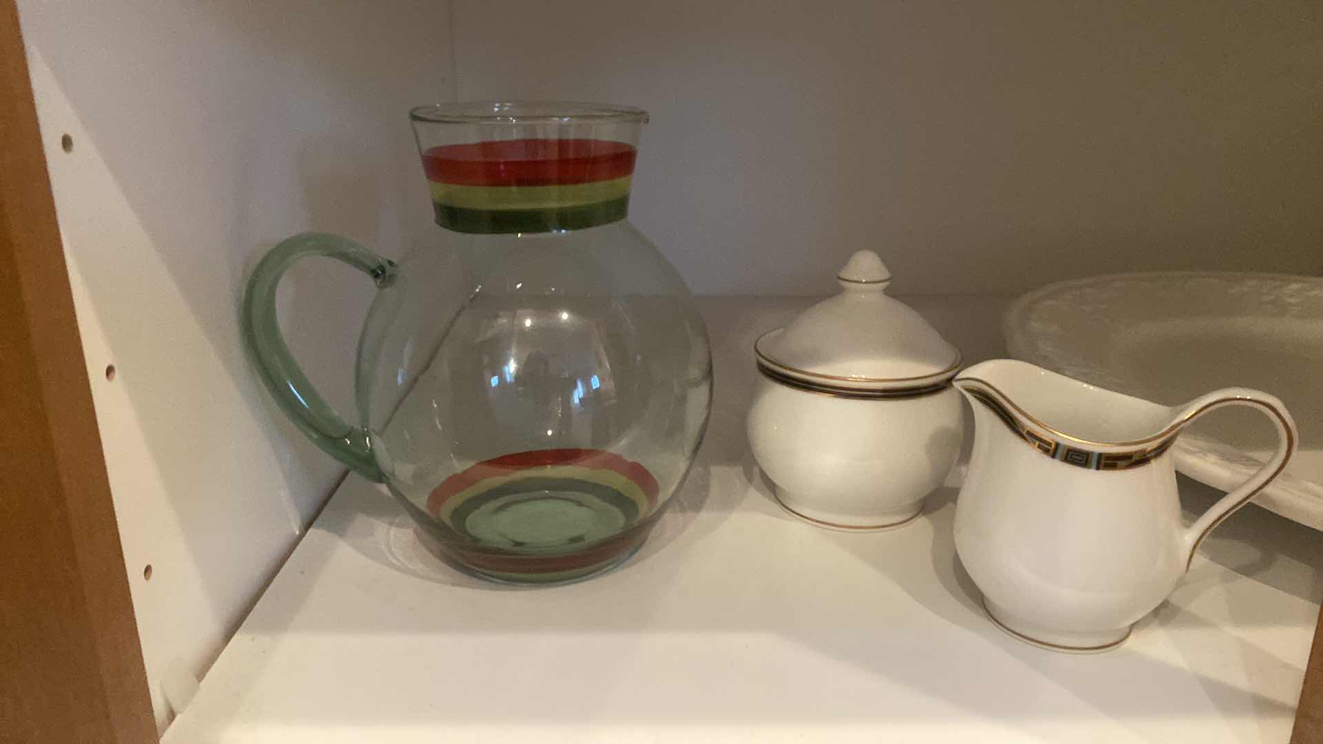 Photo 1 of CONTENTS OF CABINET - 2 SHELFS CERAMIC SERVE WARE & GLASS PITCHER