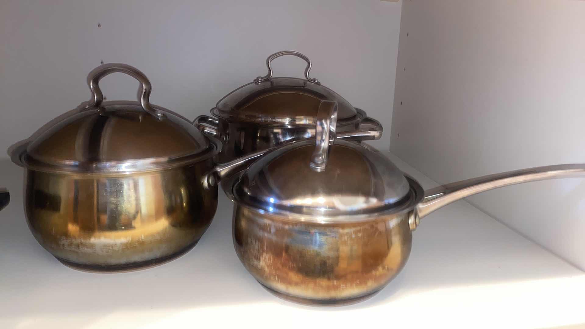 Photo 1 of CONTENTS OF CABINET - POTS & PANS