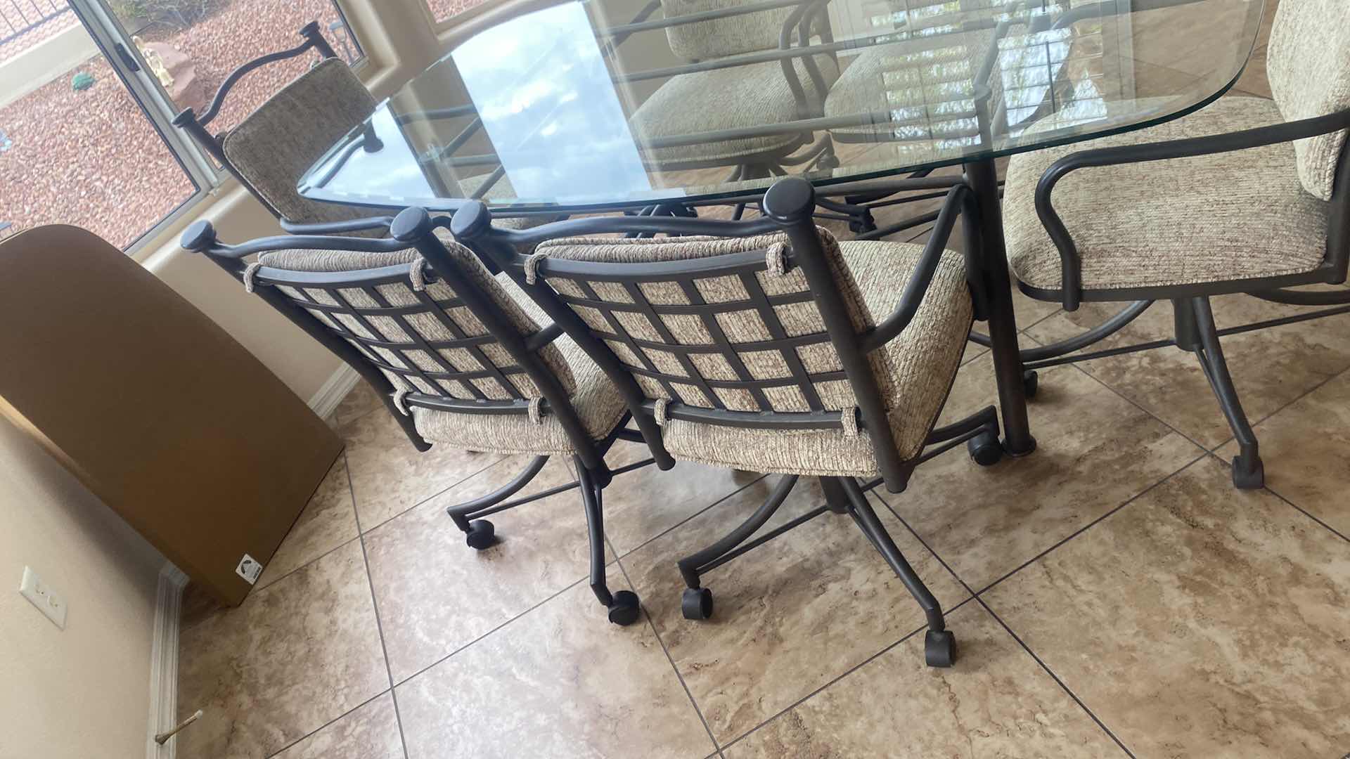 Photo 1 of 7 PIECE GLASS TOP & HEAVY METAL DINING SET, CHAIRS HAVE WHEELS, INCLUDES TABLE PADS 6’ x 42” H30”