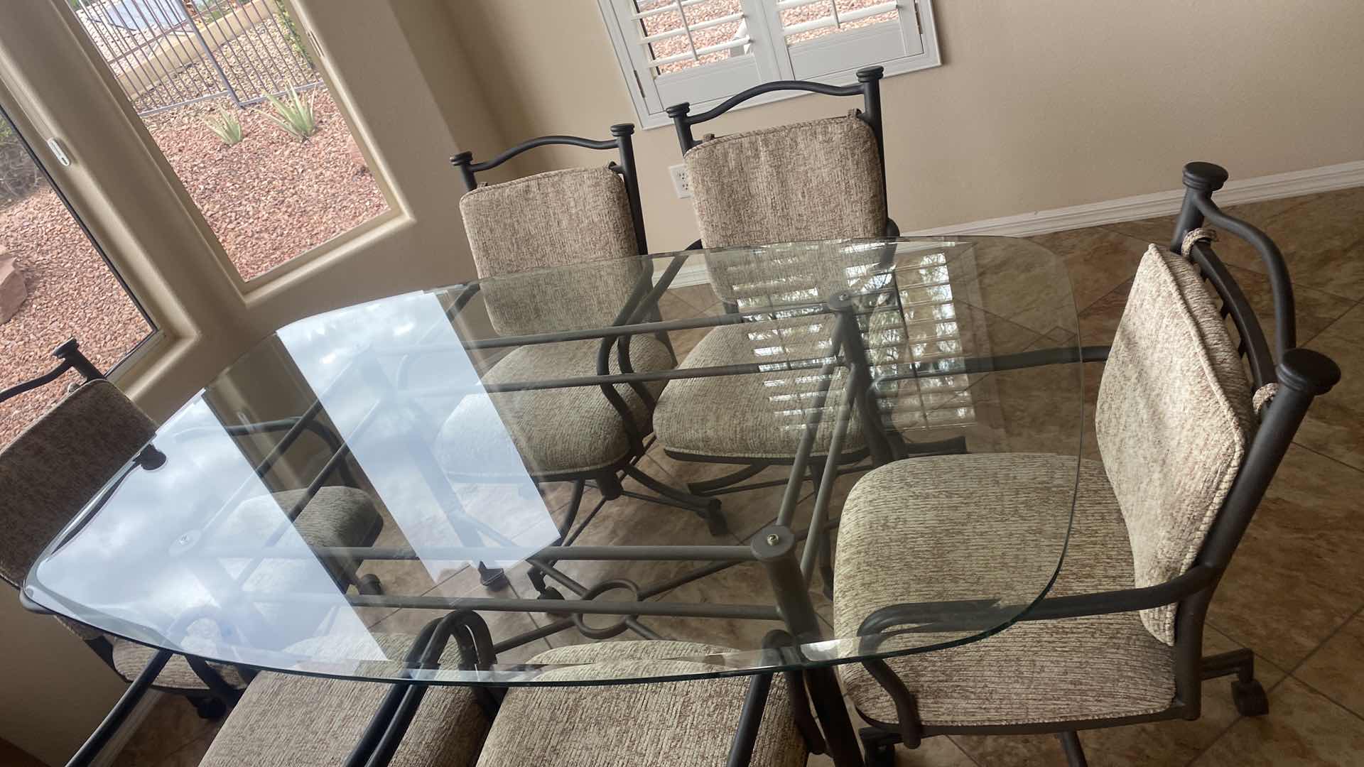 Photo 1 of 7 PIECE GLASS TOP & HEAVY METAL DINING SET, CHAIRS HAVE WHEELS, INCLUDES TABLE PADS 6’ x 42” H30”