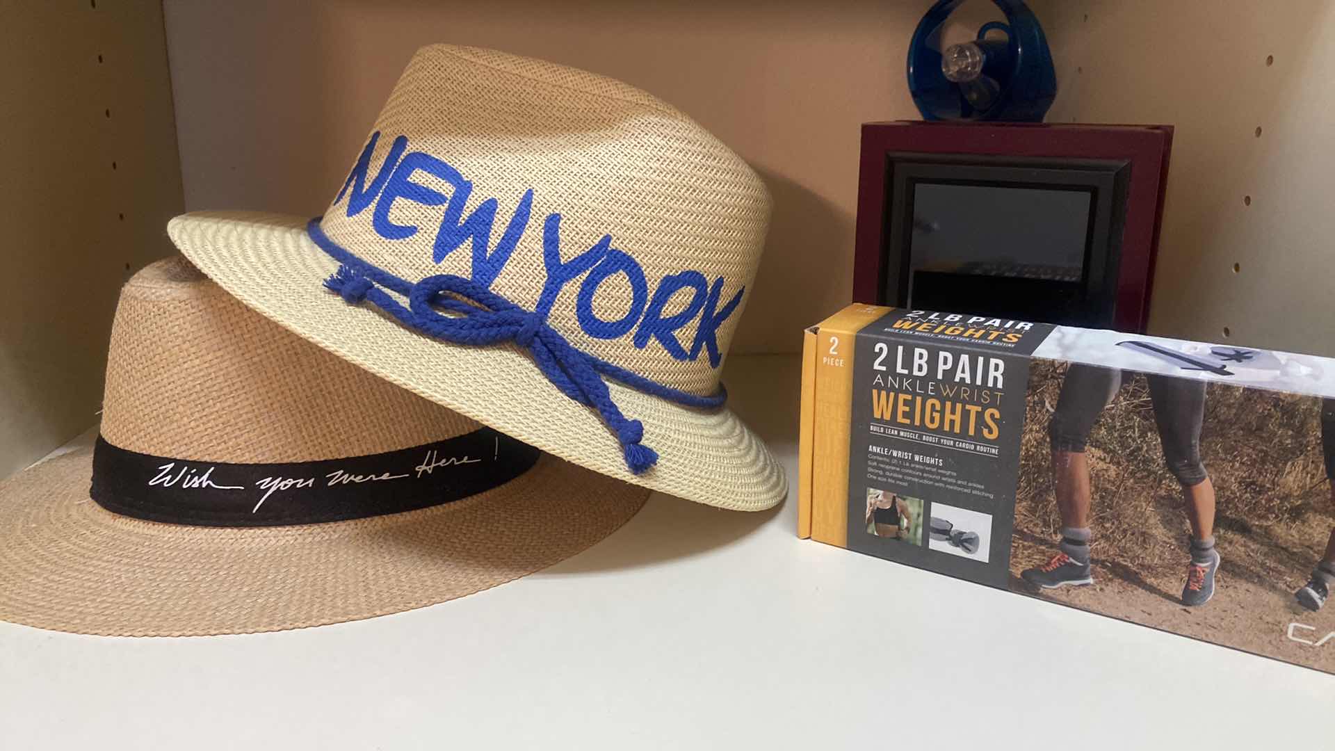 Photo 1 of 3 SHELFS WOMENS HATS, STRIPED BAG, CROSS , SUNGLASSES & WEIGHTS