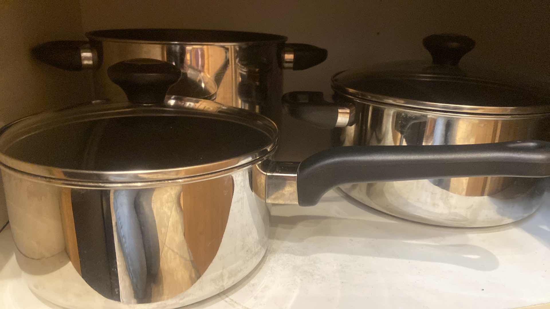 Photo 1 of CONTENTS OF CABINET- ULTREX POTS & PANS 8 PC SET