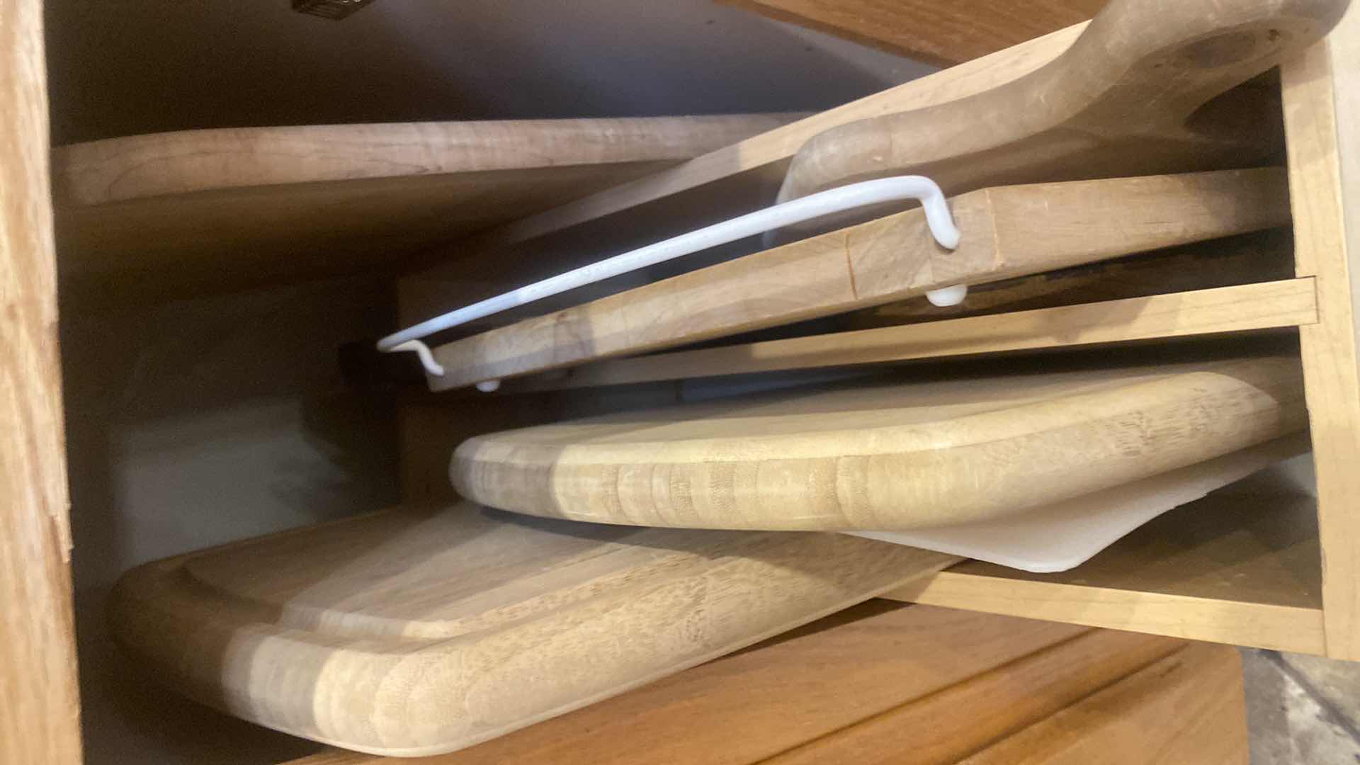 Photo 1 of CONTENTS OF CABINET-CUTTING BOARDS (holder not included)