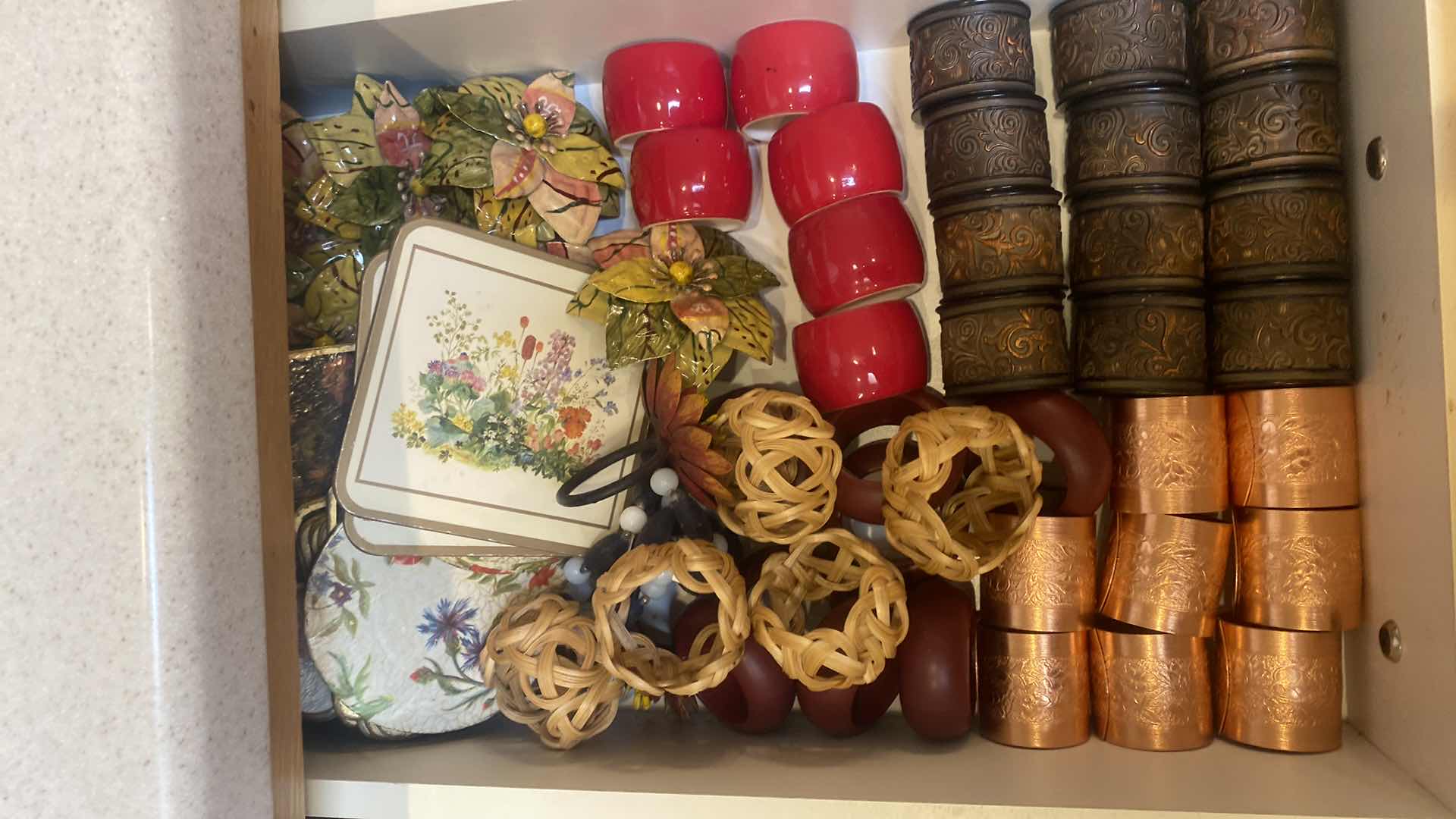 Photo 1 of CONTENTS OF CABINET-2 DRAWERS JUNK & NAPKIN RINGS