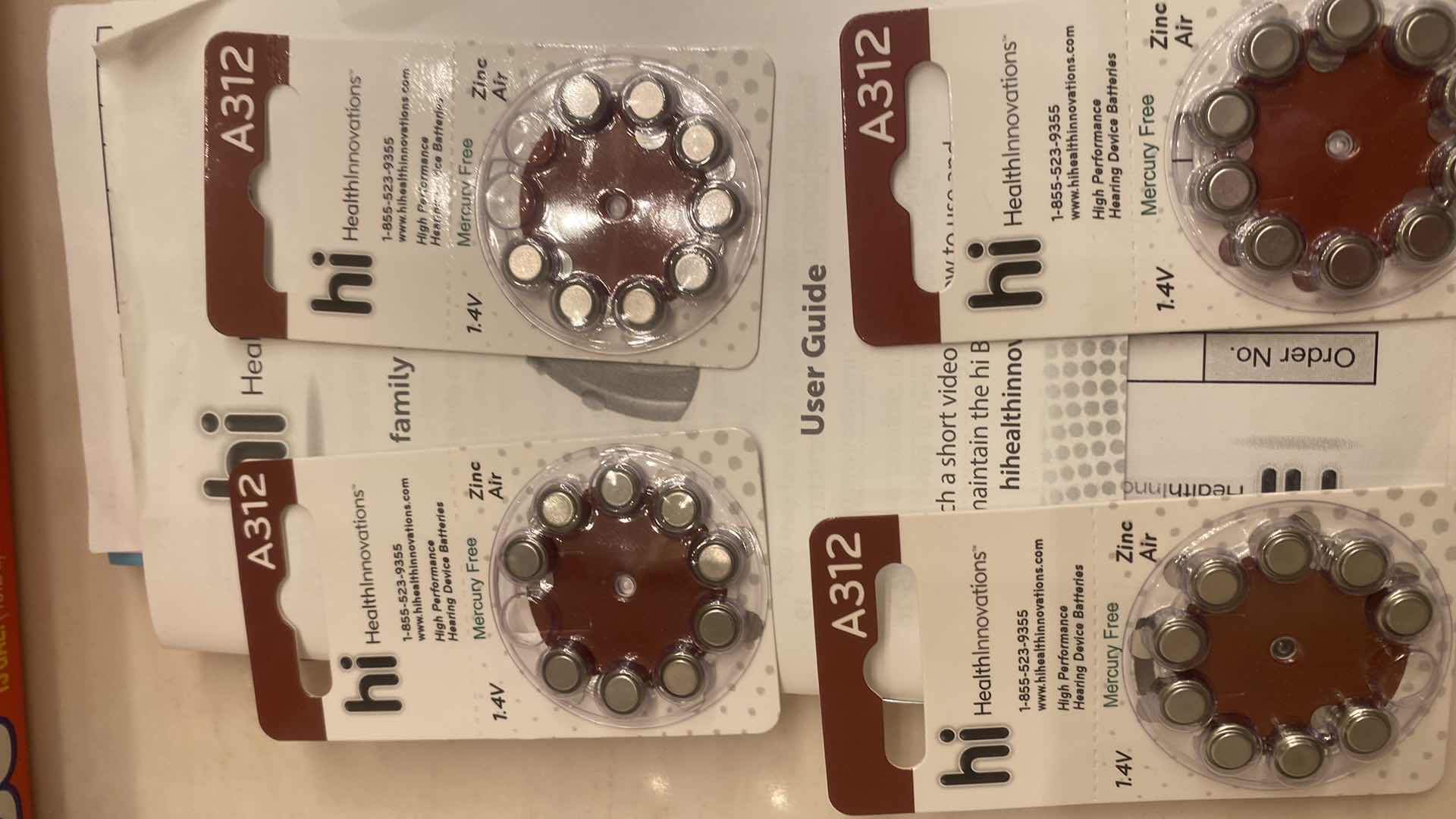 Photo 1 of HI HEARING AIDS WITH BATTERIES & BOOKLET EST VALUE $330.00