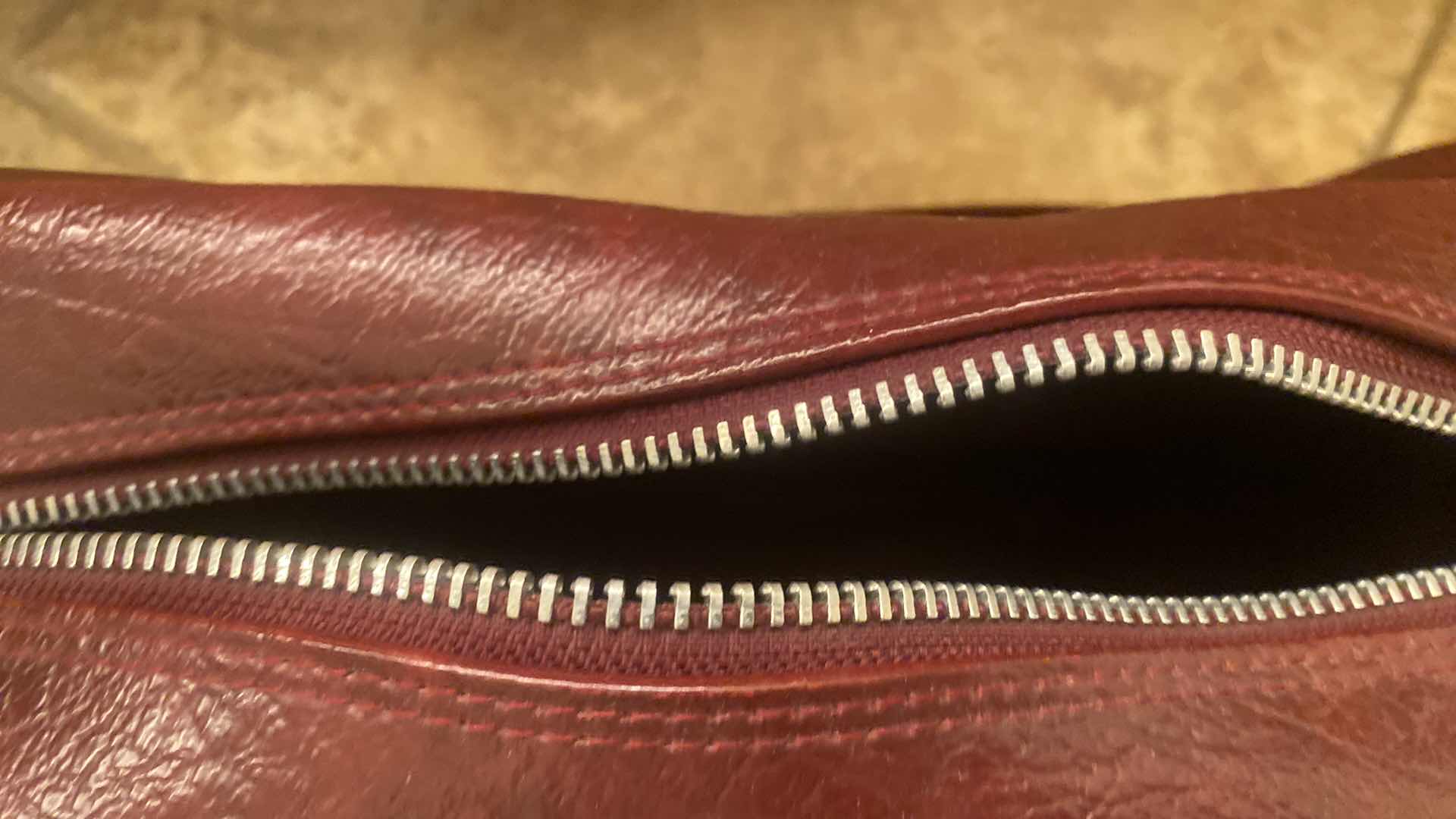 Photo 1 of AMERICAN TOURISTER BURGUNDY CARRY ON