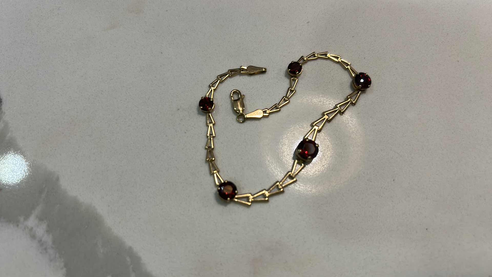 Photo 1 of 14K GOLD BRACELET WITH RED GEM STONES