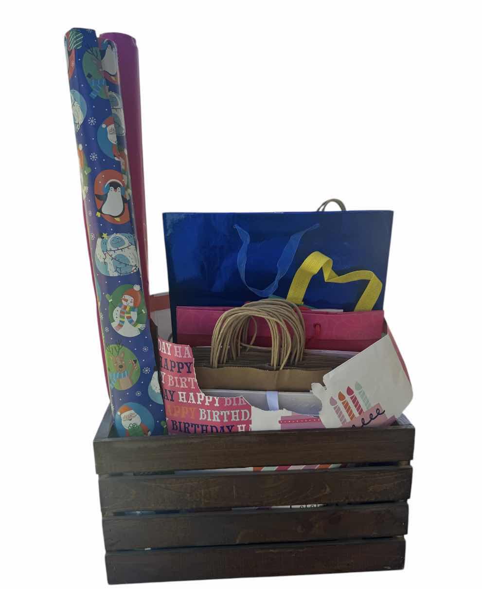 Photo 1 of WOODEN CRATE WITH ASSORTED WRAPPING SUPPLIES, GIFT BAGS, RIBBONS, STREAMERS 

WOODEN CRATE 
18” X 12.5” X H9.5”