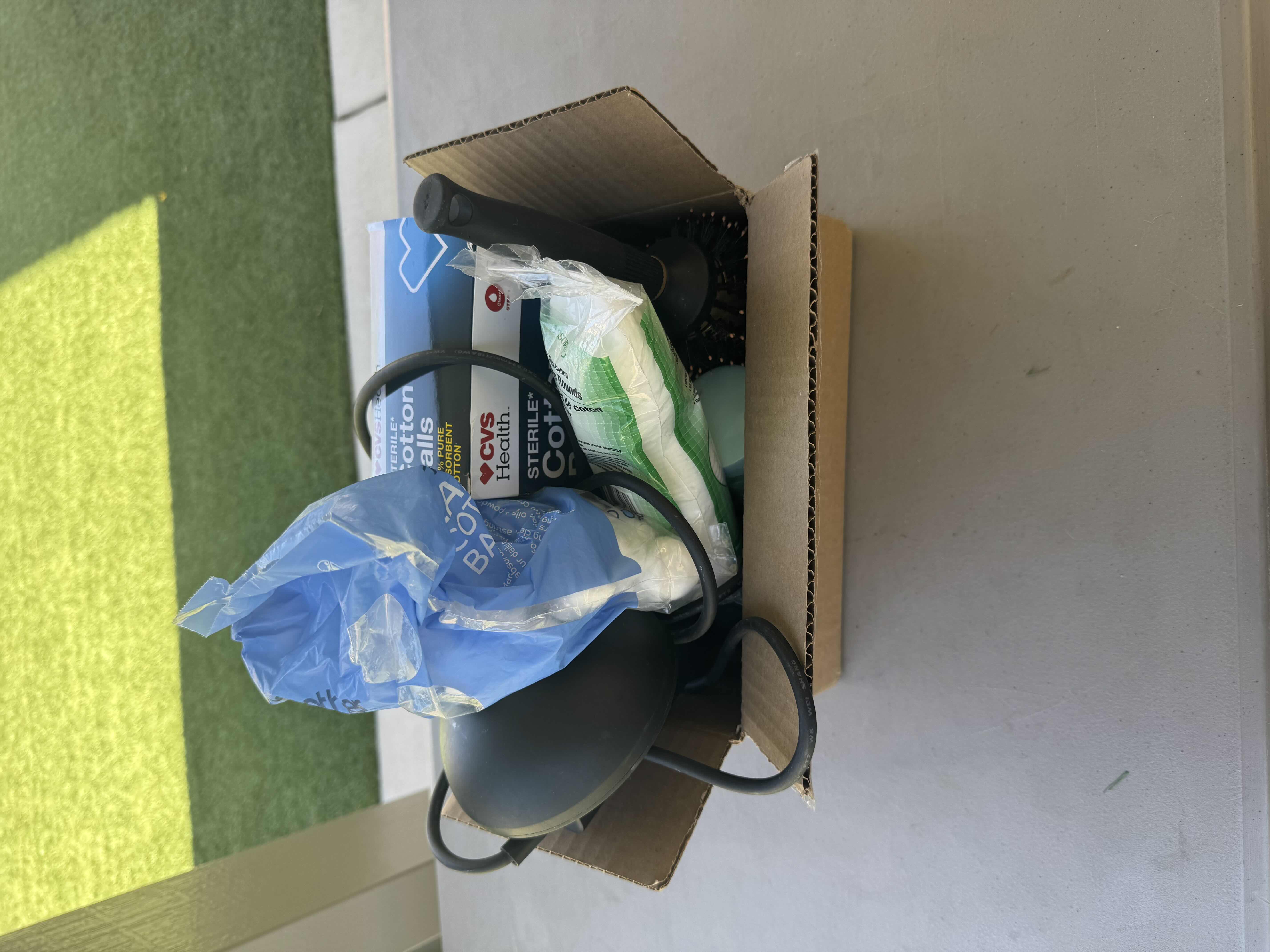 Photo 1 of BOX WITH CONTENTS OF BATHROOM CABINET, BLOWDRYER, BLOWDRYER ACCESSORIES, COTTON BALLS, COTTON ROUNDS, SUGAR SCRUB, ROUND BRUSH