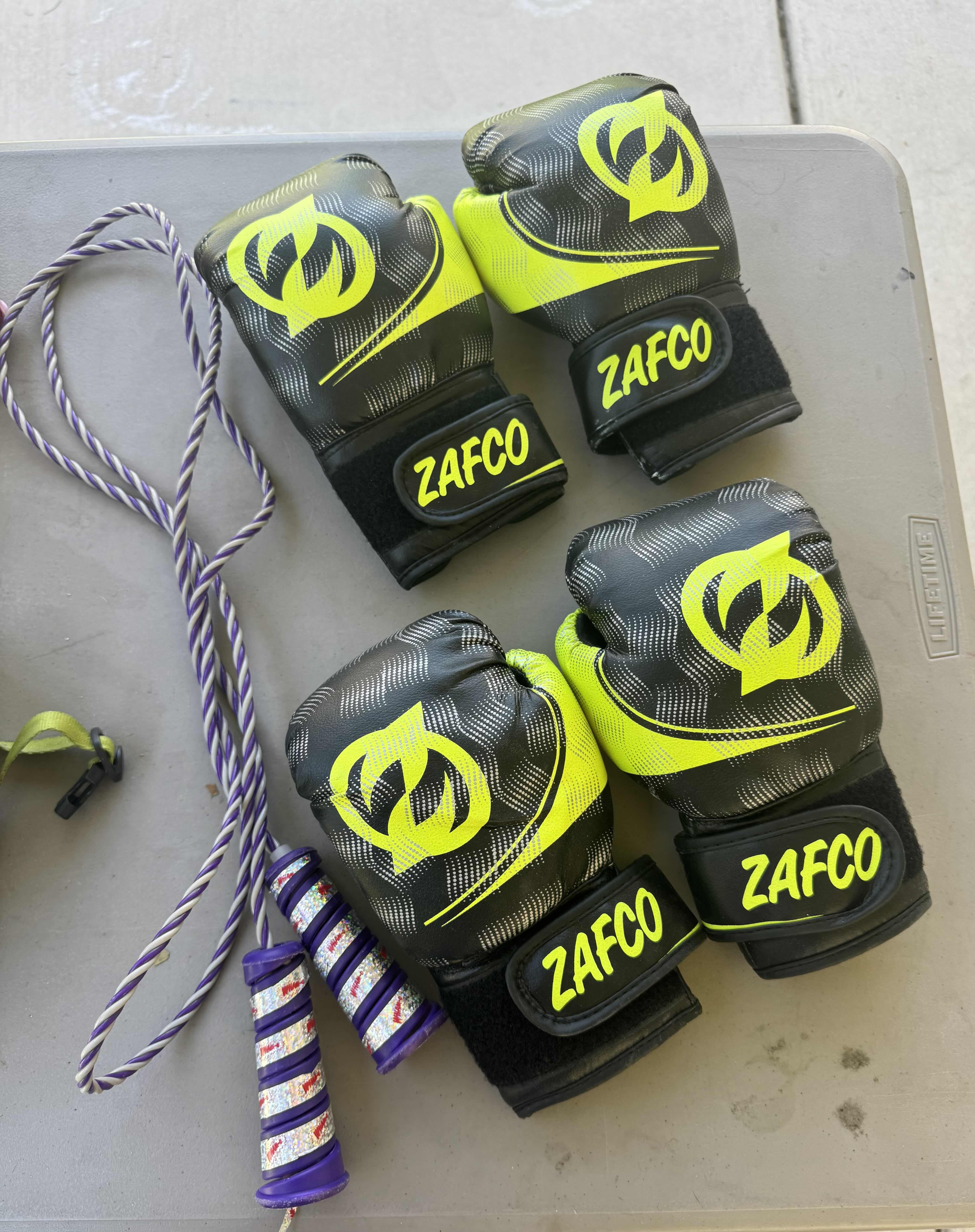 Photo 3 of ASSORTED HELMETS, ORANGE CONES, JUMPROPE, 2 PAIRS OF BOXING GLOVES, OUTDOOR ACTIVITIES
*TABLE NOT INCLUDED*