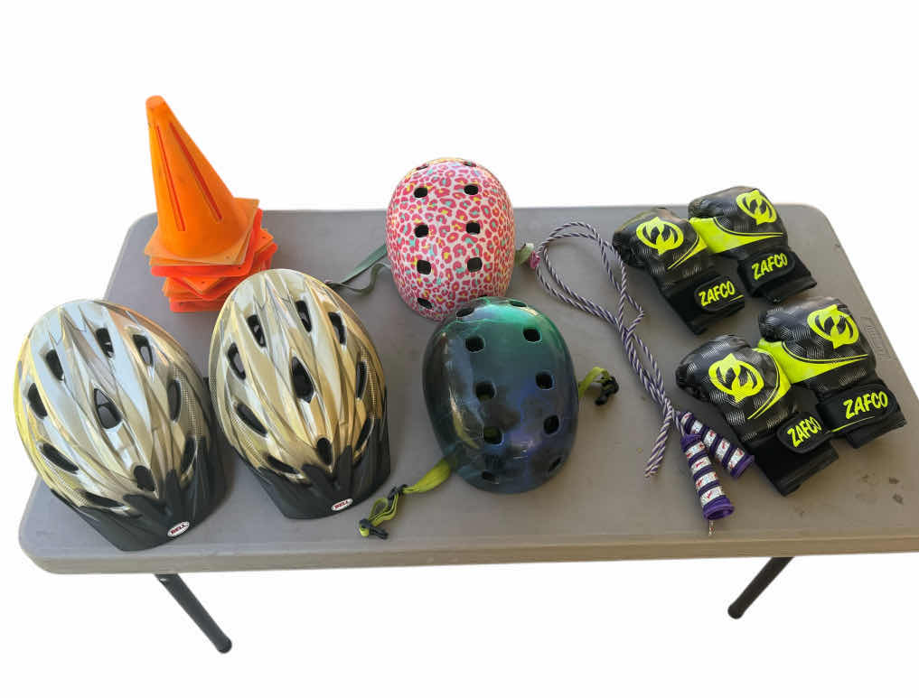 Photo 1 of ASSORTED HELMETS, ORANGE CONES, JUMPROPE, 2 PAIRS OF BOXING GLOVES, OUTDOOR ACTIVITIES
*TABLE NOT INCLUDED*