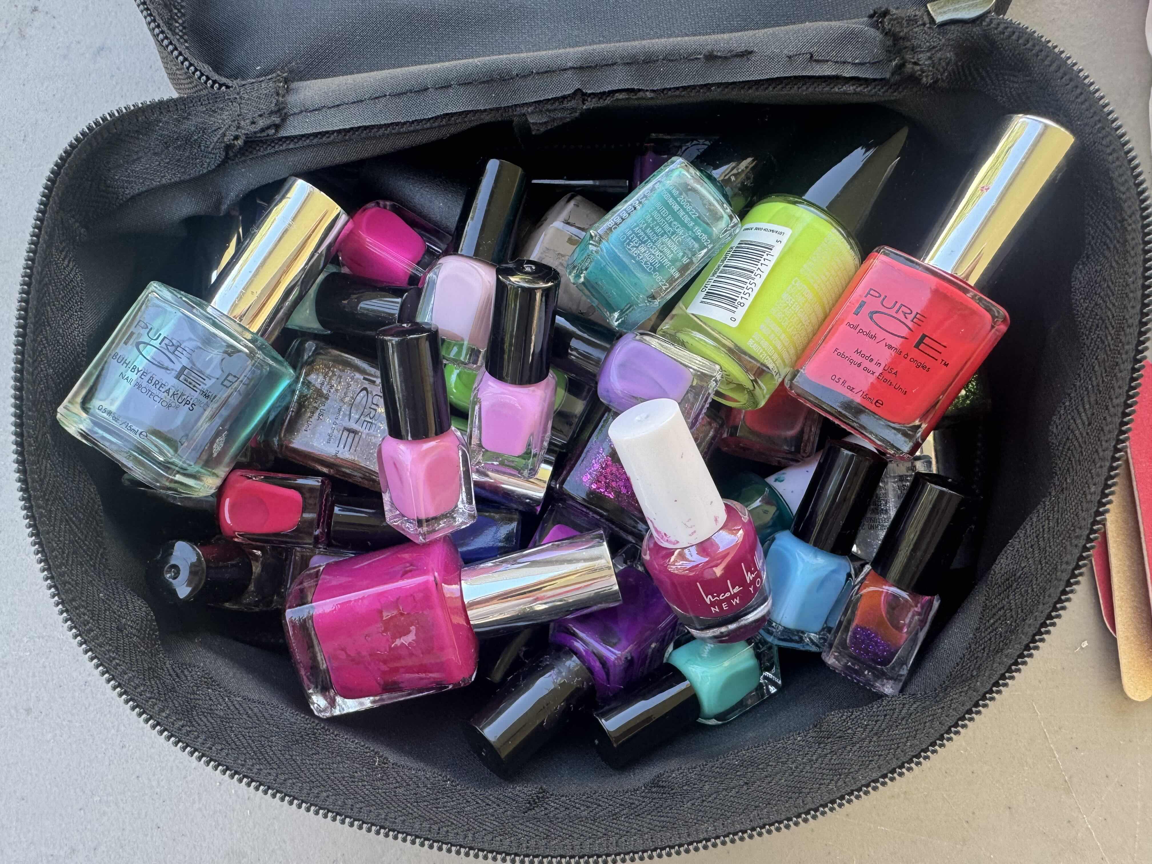 Photo 1 of BLACK TRAVEL BAG WITH NAIL POLISH, NAIL FILES, TOE SEPARATOR, FAKE NAILS