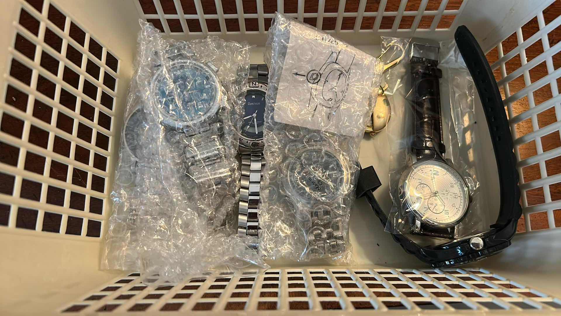 Photo 1 of CONTENTS OF BASKET ASSORTED WATCHS