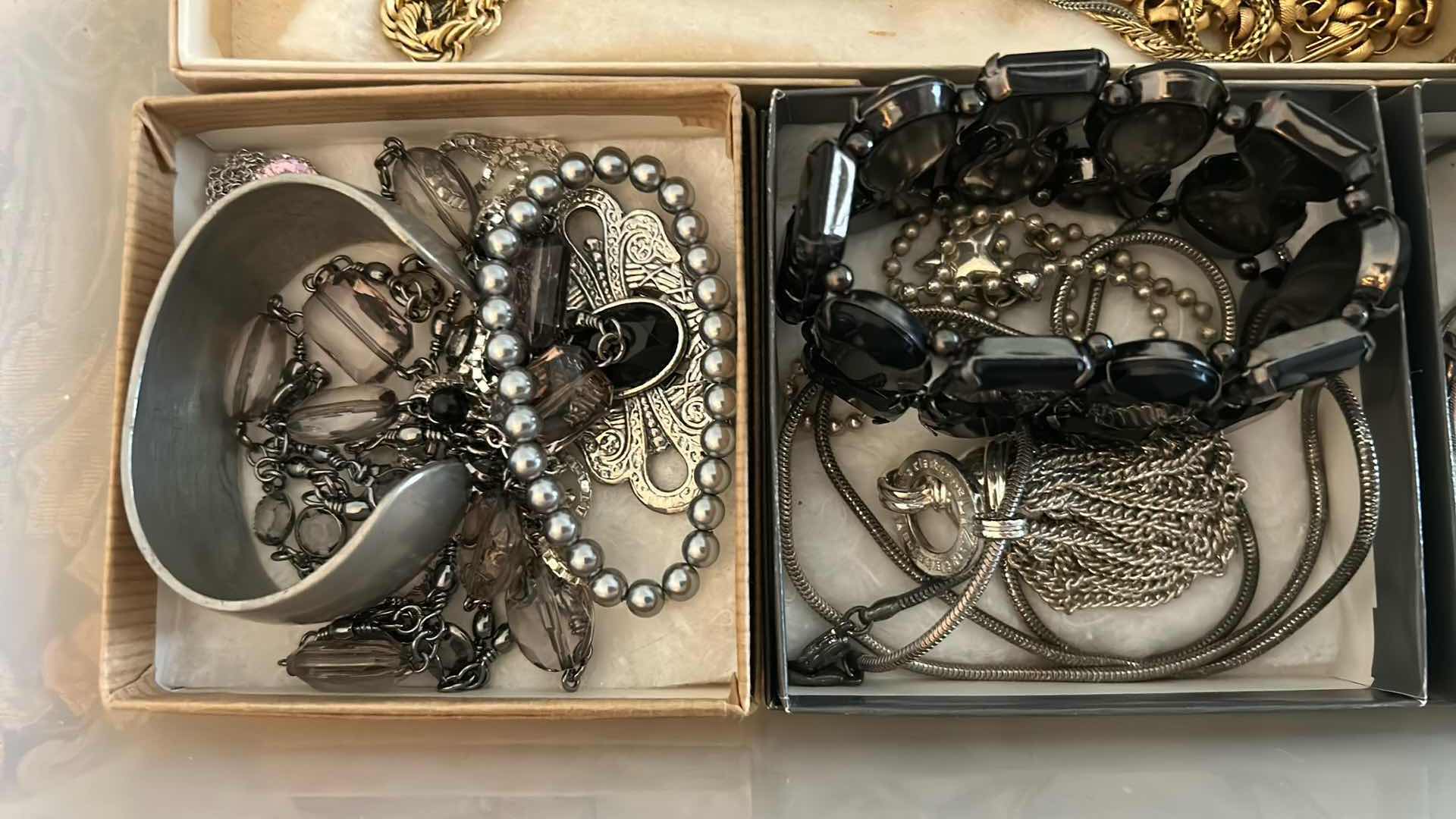 Photo 1 of CONTENTS OF CONTAINER ASSORTED WOMENS COSTUME JEWELRY