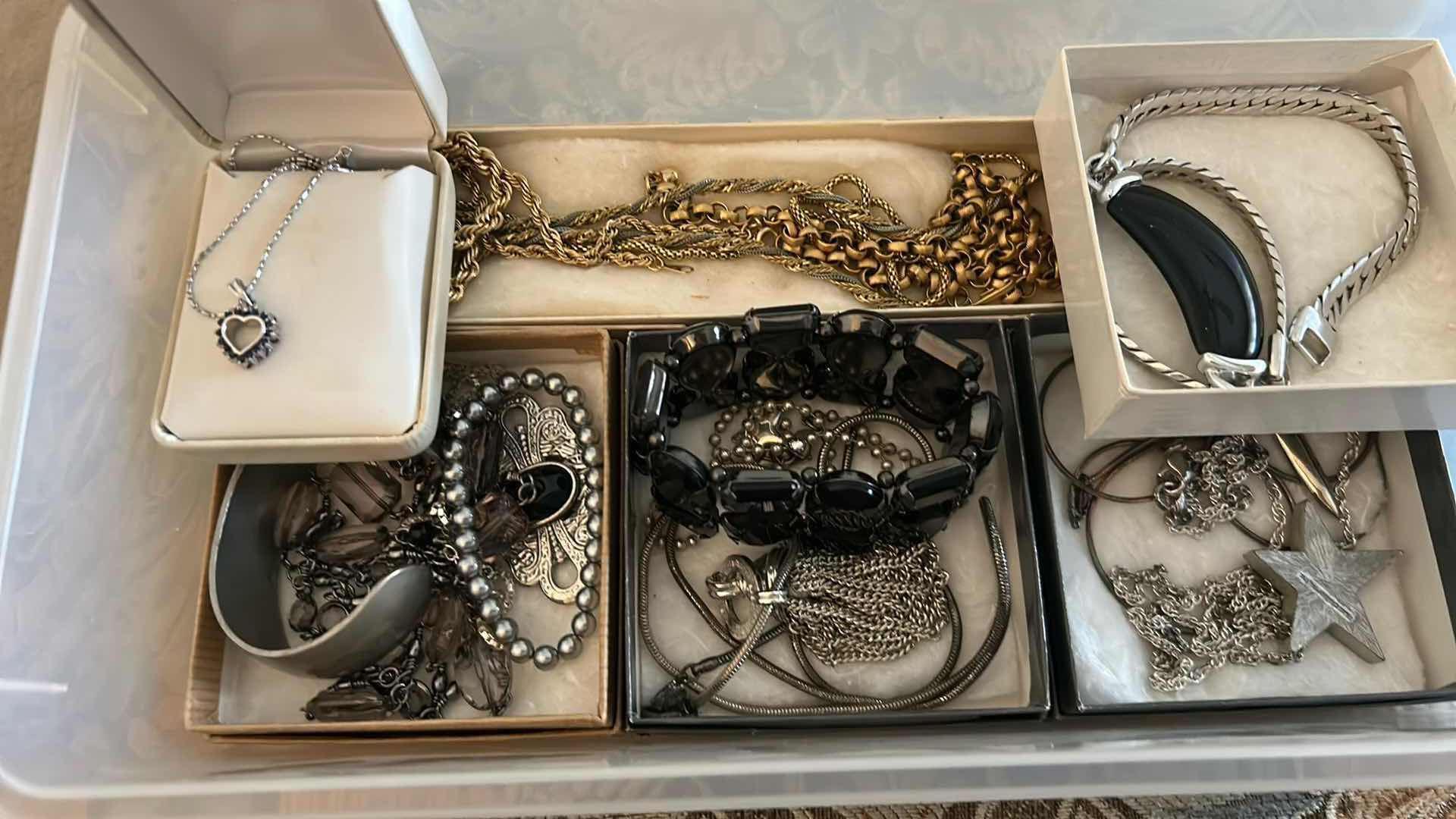 Photo 1 of CONTENTS OF CONTAINER ASSORTED WOMENS COSTUME JEWELRY